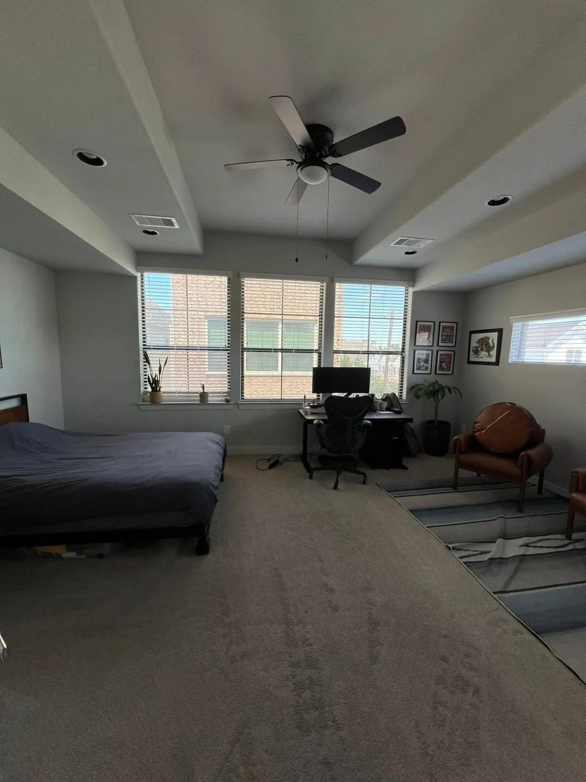 The primary bedroom showing the large windows (previous professional photos did not capture this and the bed was placed on the other side of the spaceous room)