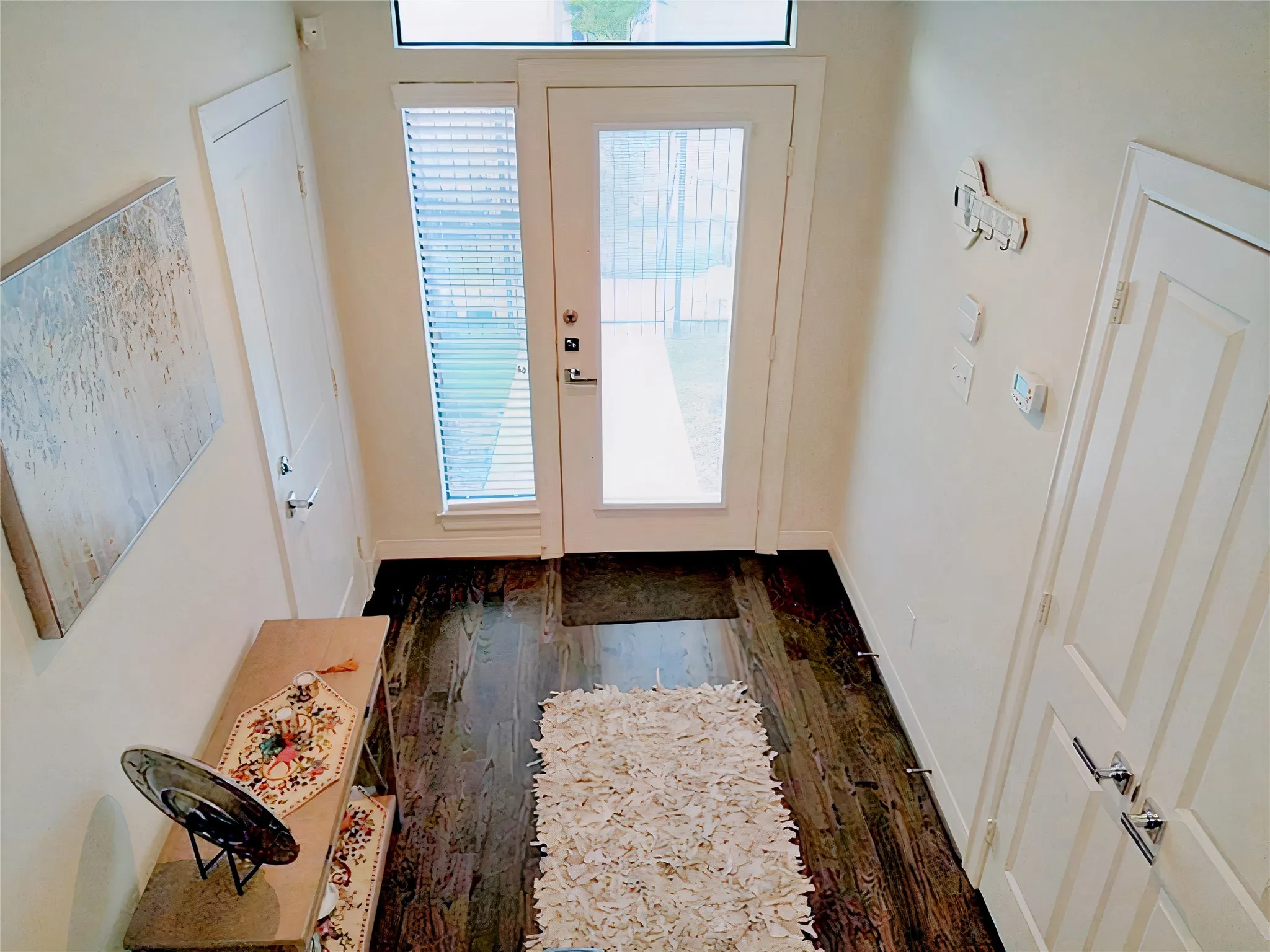 To the right is the third bedroom on the ground floor, while to the left is the two-car garage.