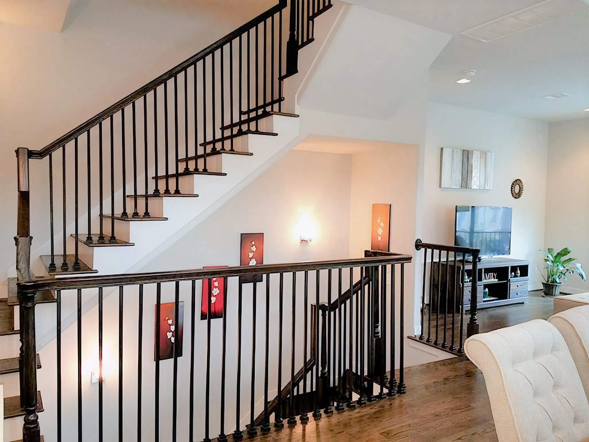 The half bathroom is located on the staircase landing to the left.