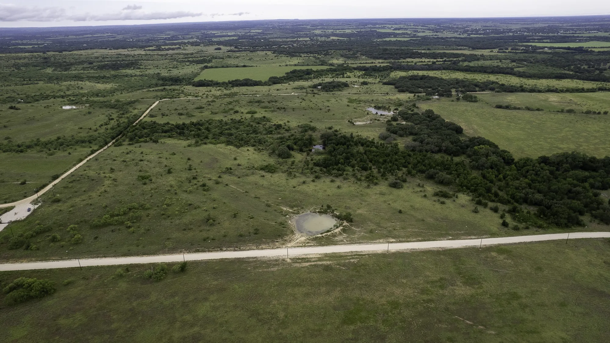 Aerial view of property and surrounding area with rural landscape
