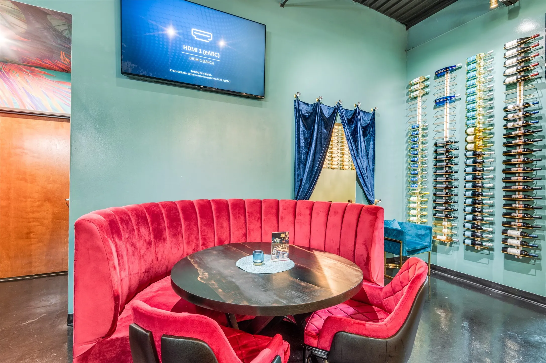 Dining space with concrete floors and a high ceiling