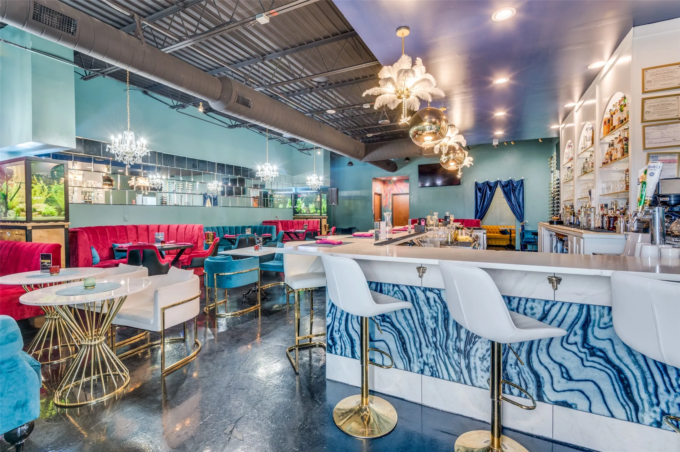 Dining space with concrete floors and a high ceiling
