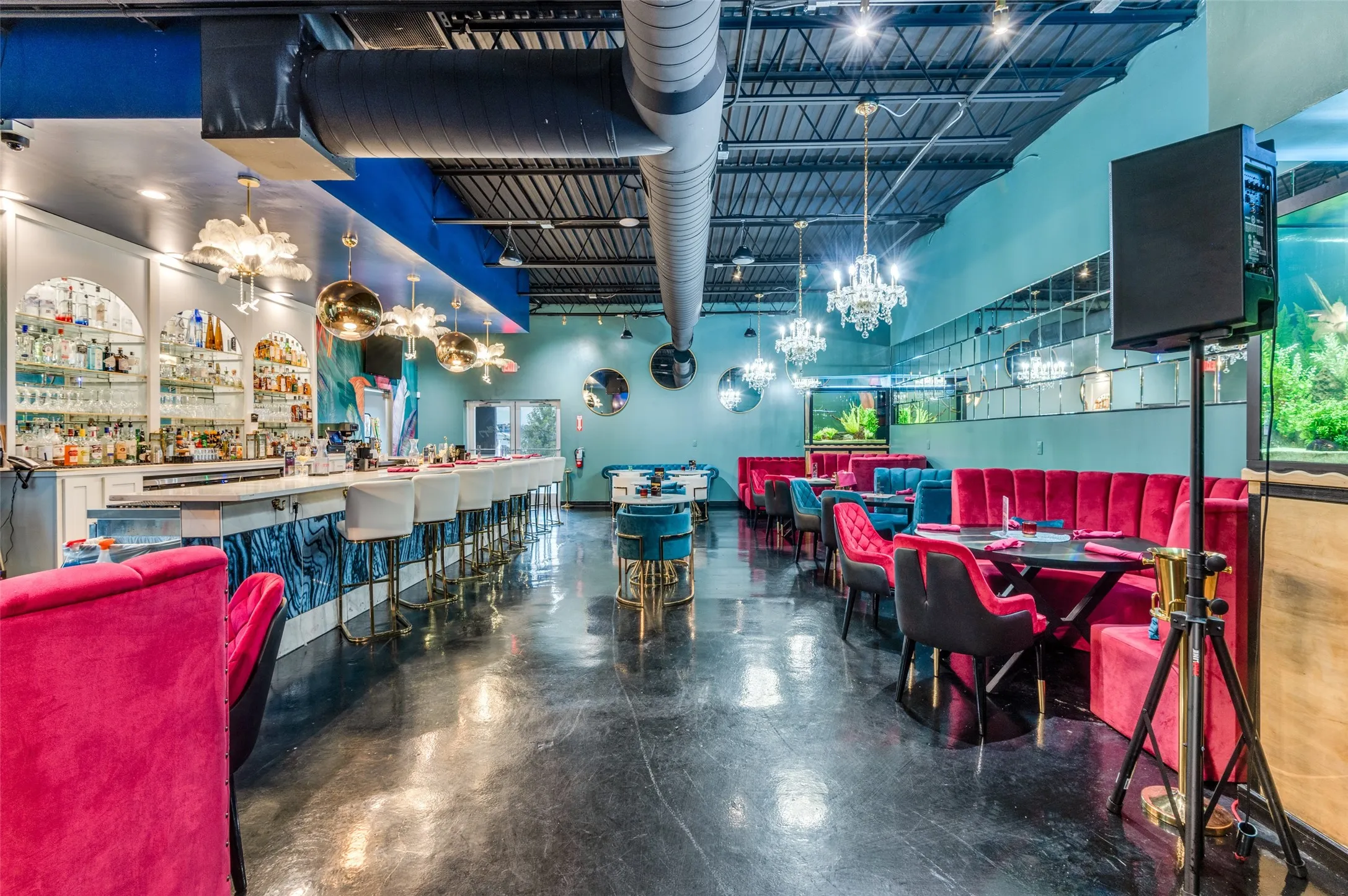 Dining space with concrete floors and a high ceiling
