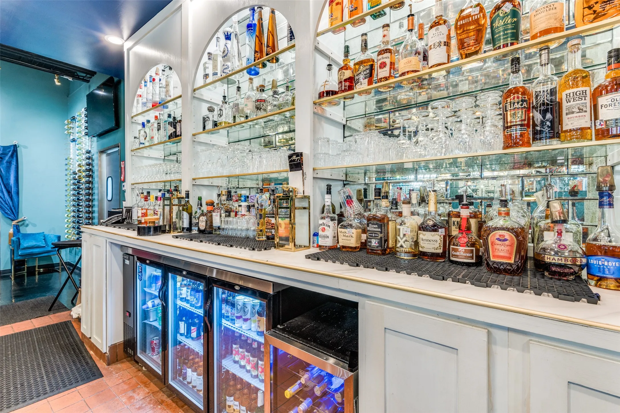 Bar area with wine cooler and tile patterned flooring