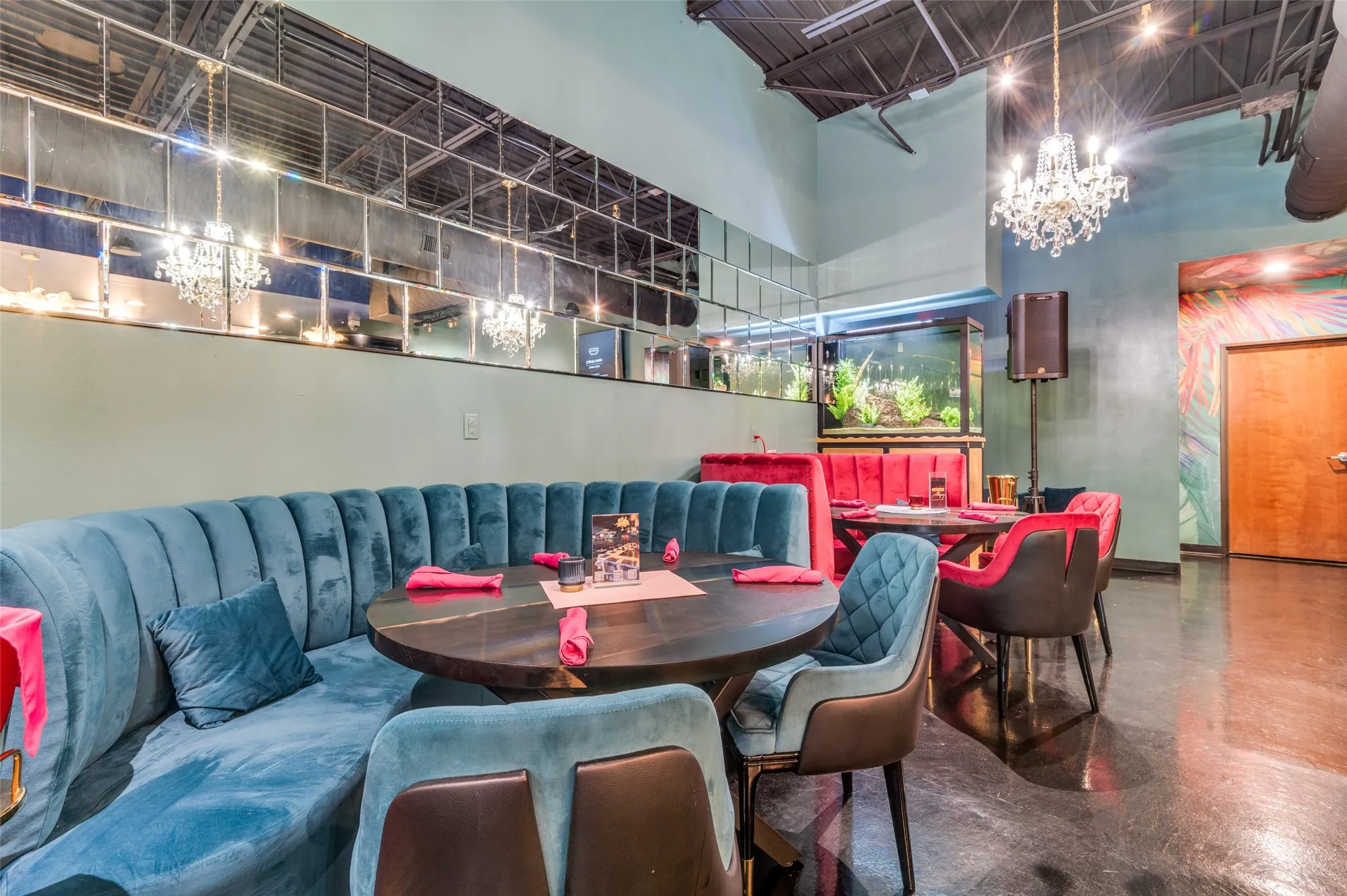 Dining space with concrete floors and a high ceiling