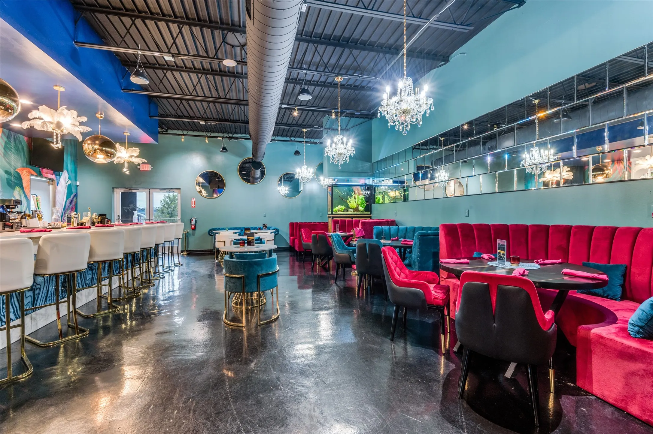 Dining space with concrete floors and a high ceiling