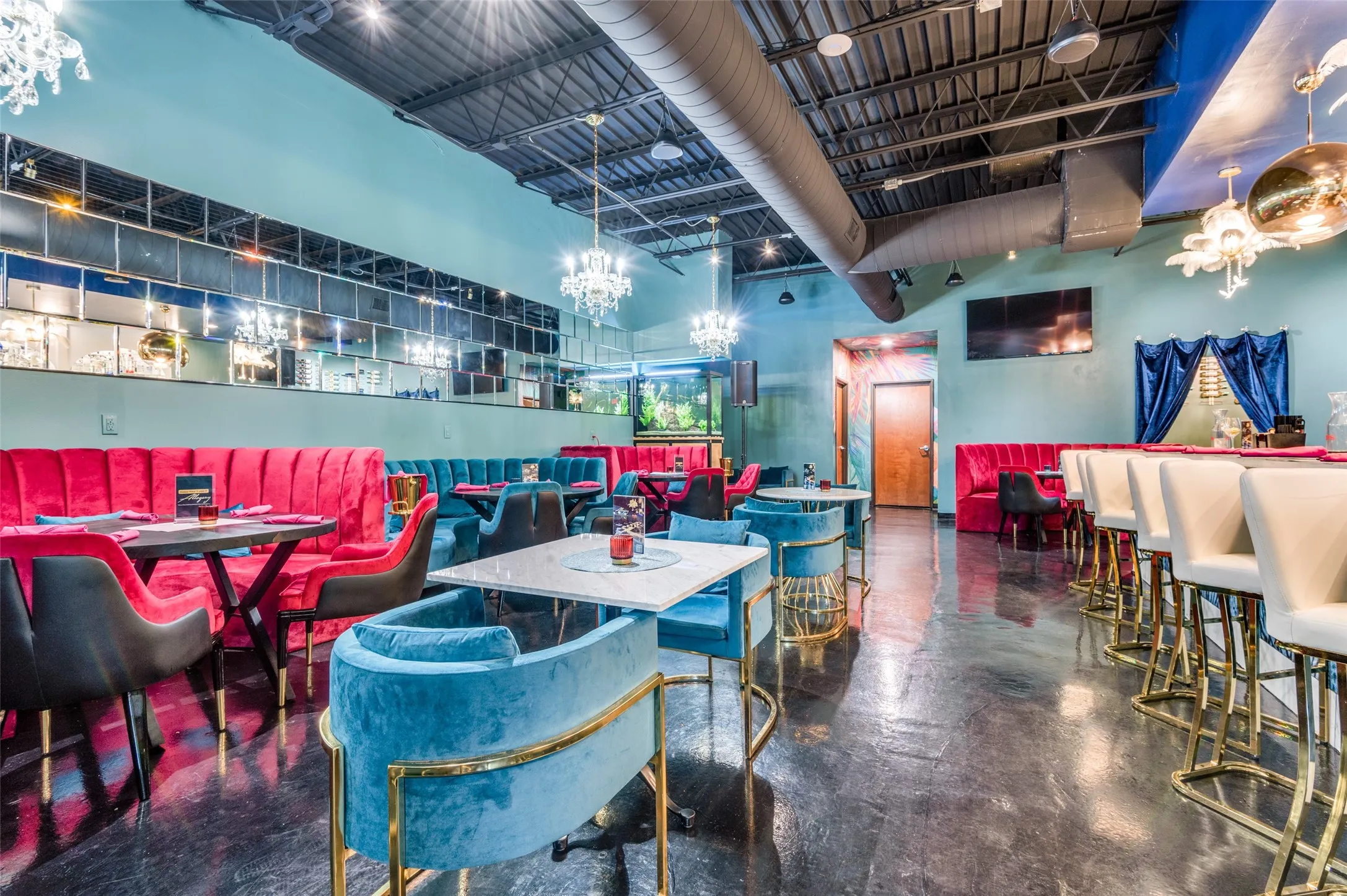 Dining space with concrete floors and a high ceiling