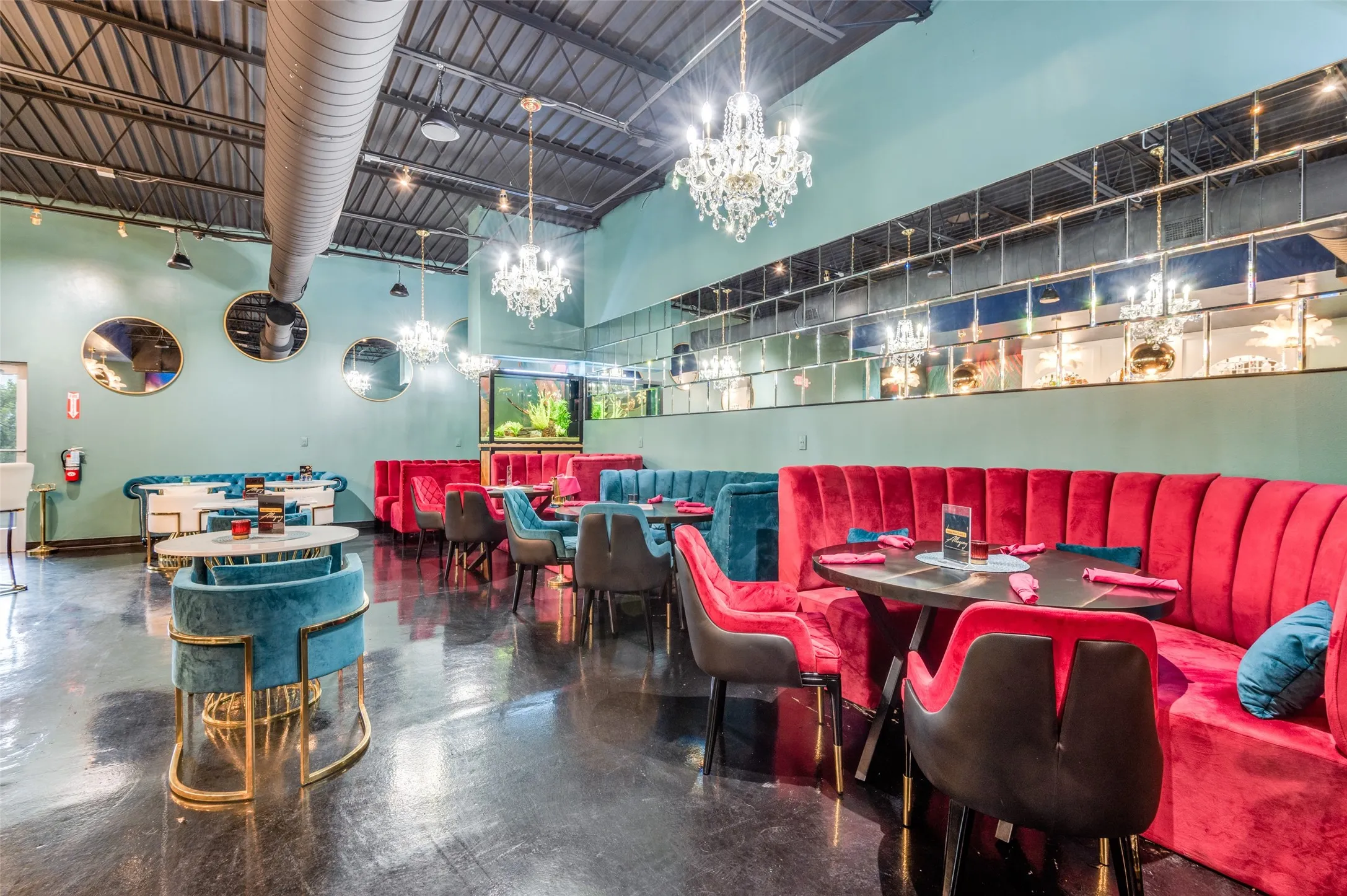Dining space with concrete floors and a high ceiling