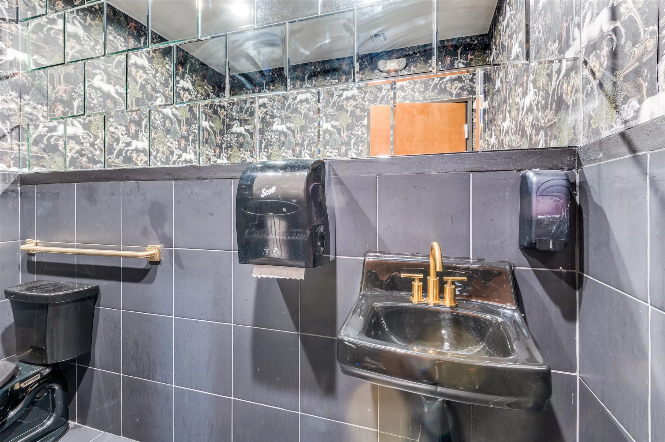 Bathroom with tile walls and a sink