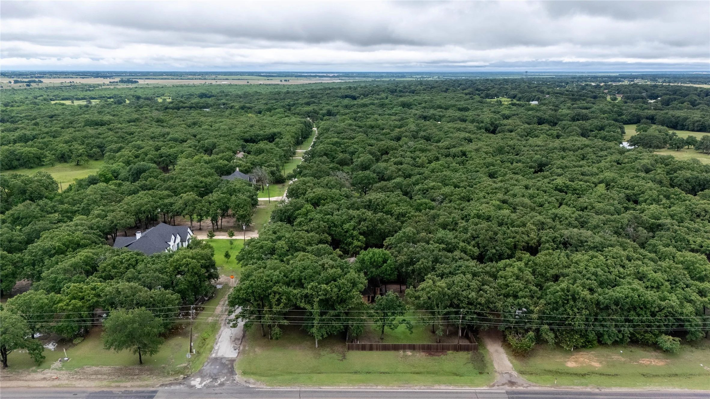 Aerial view of surrounding wooded area