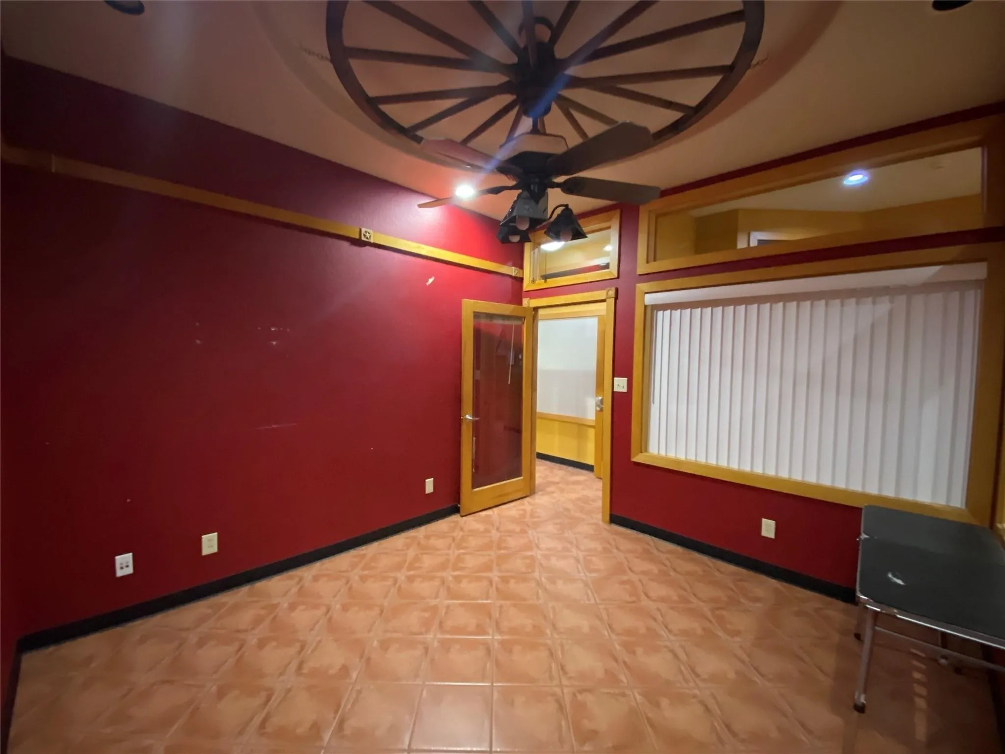 Empty room with baseboards and ceiling fan