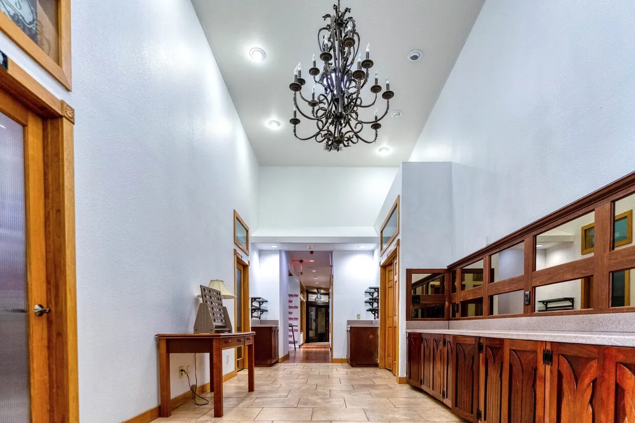 Entryway with a chandelier and a towering ceiling