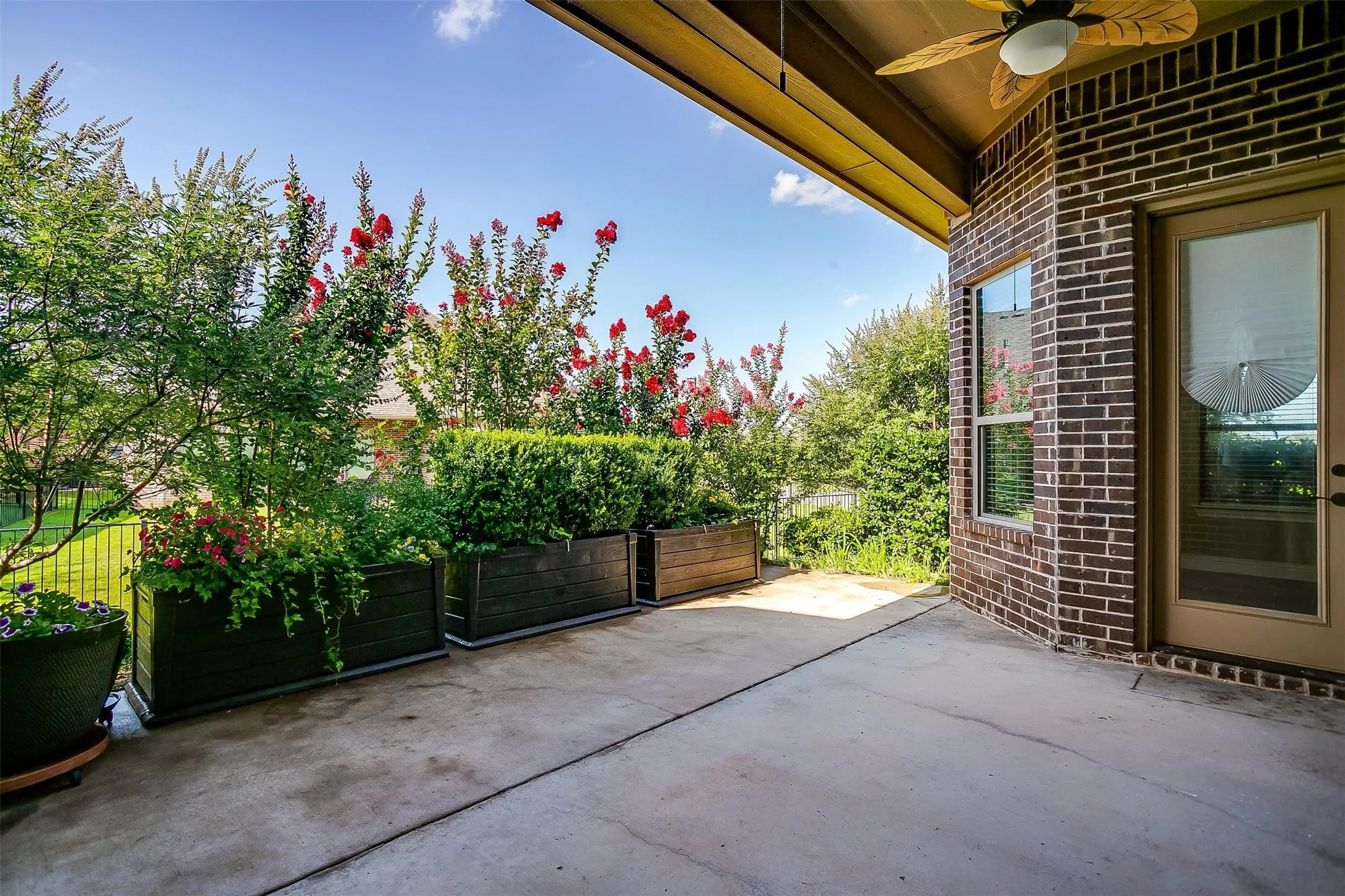 View of patio featuring ceiling fan
