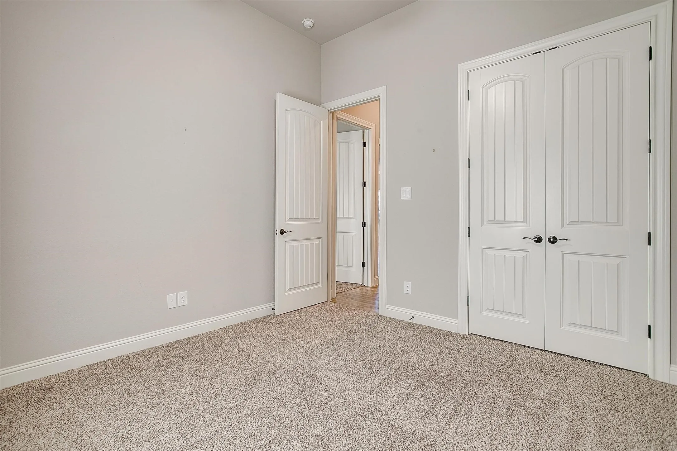 Unfurnished bedroom featuring carpet floors and a closet