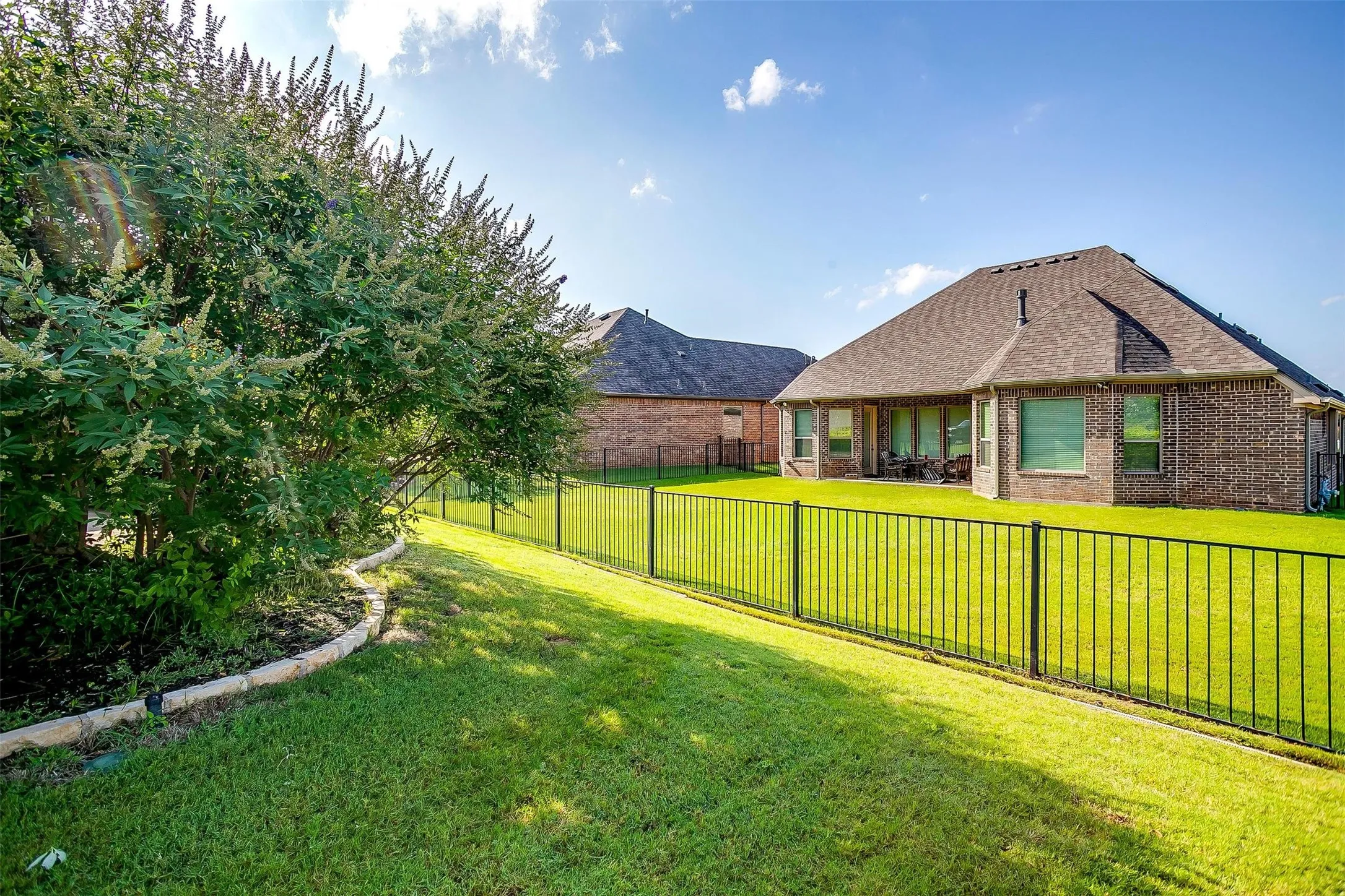 View of fenced backyard