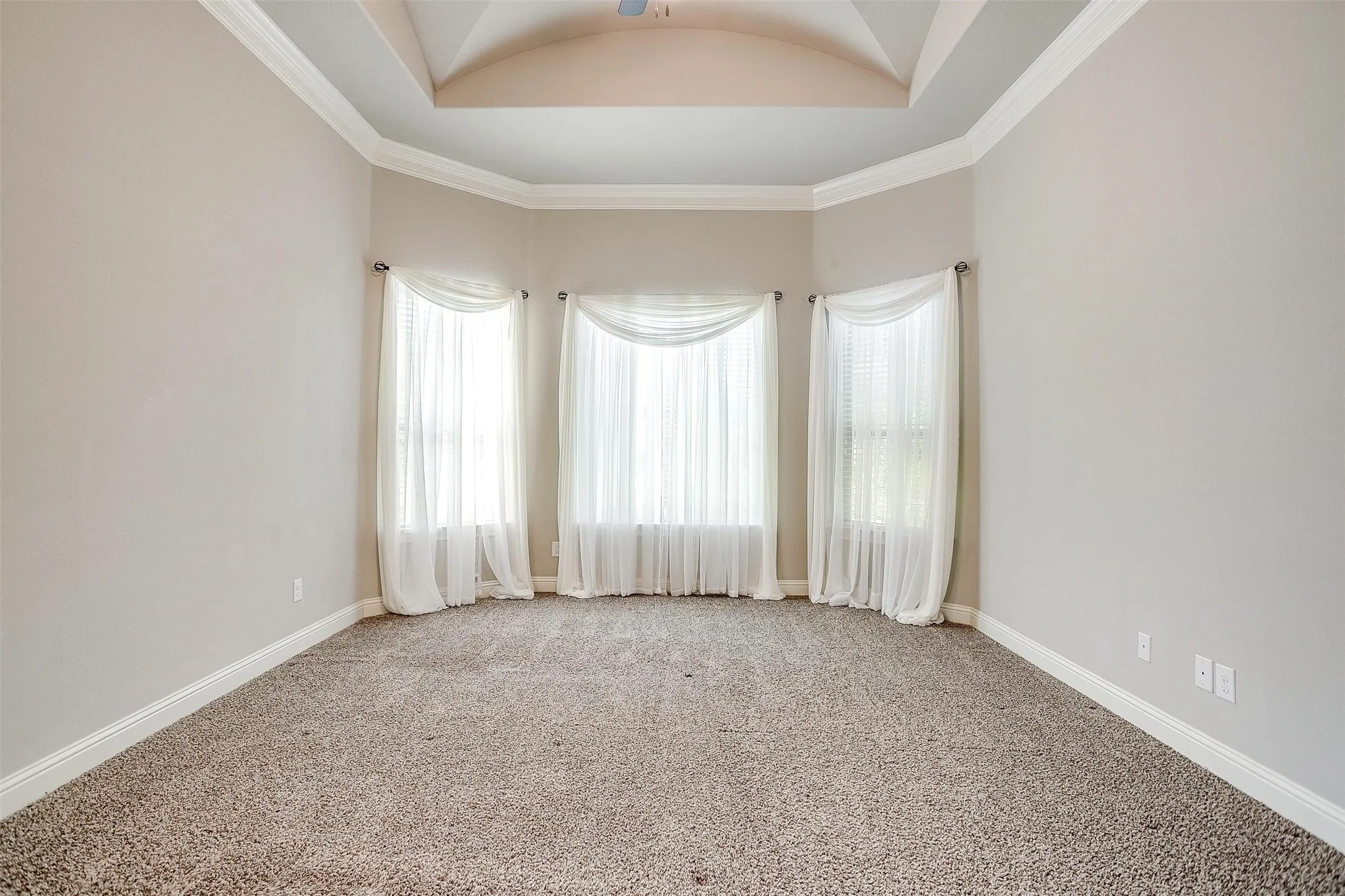 Unfurnished room featuring light carpet