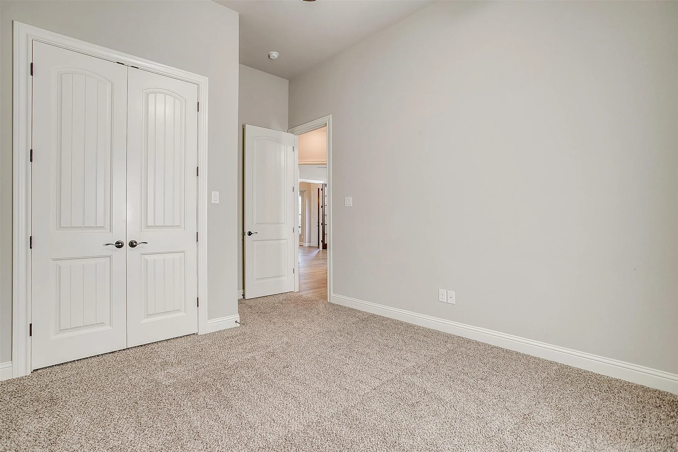 Unfurnished bedroom featuring carpet flooring and a closet