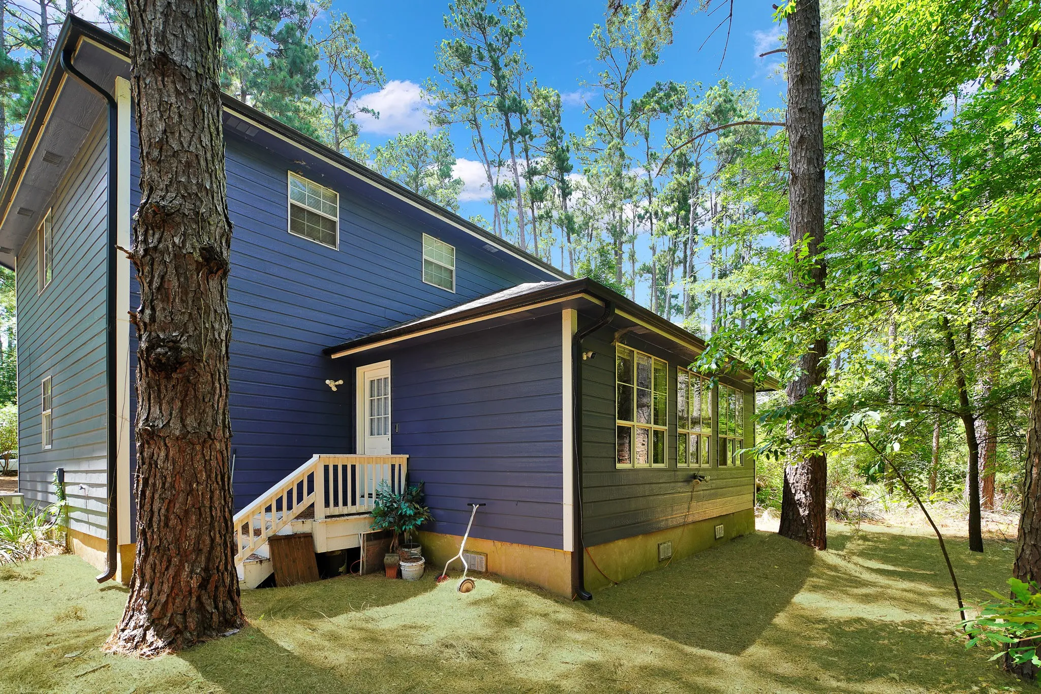 Rear view of house featuring crawl space