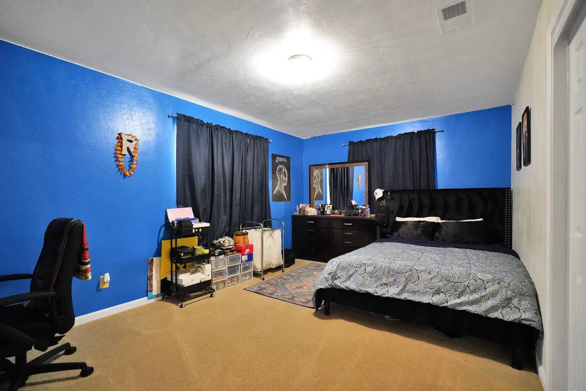 Bedroom featuring carpet flooring and an office area