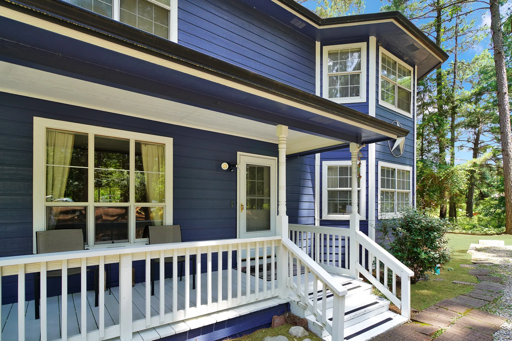 Doorway to property with covered porch