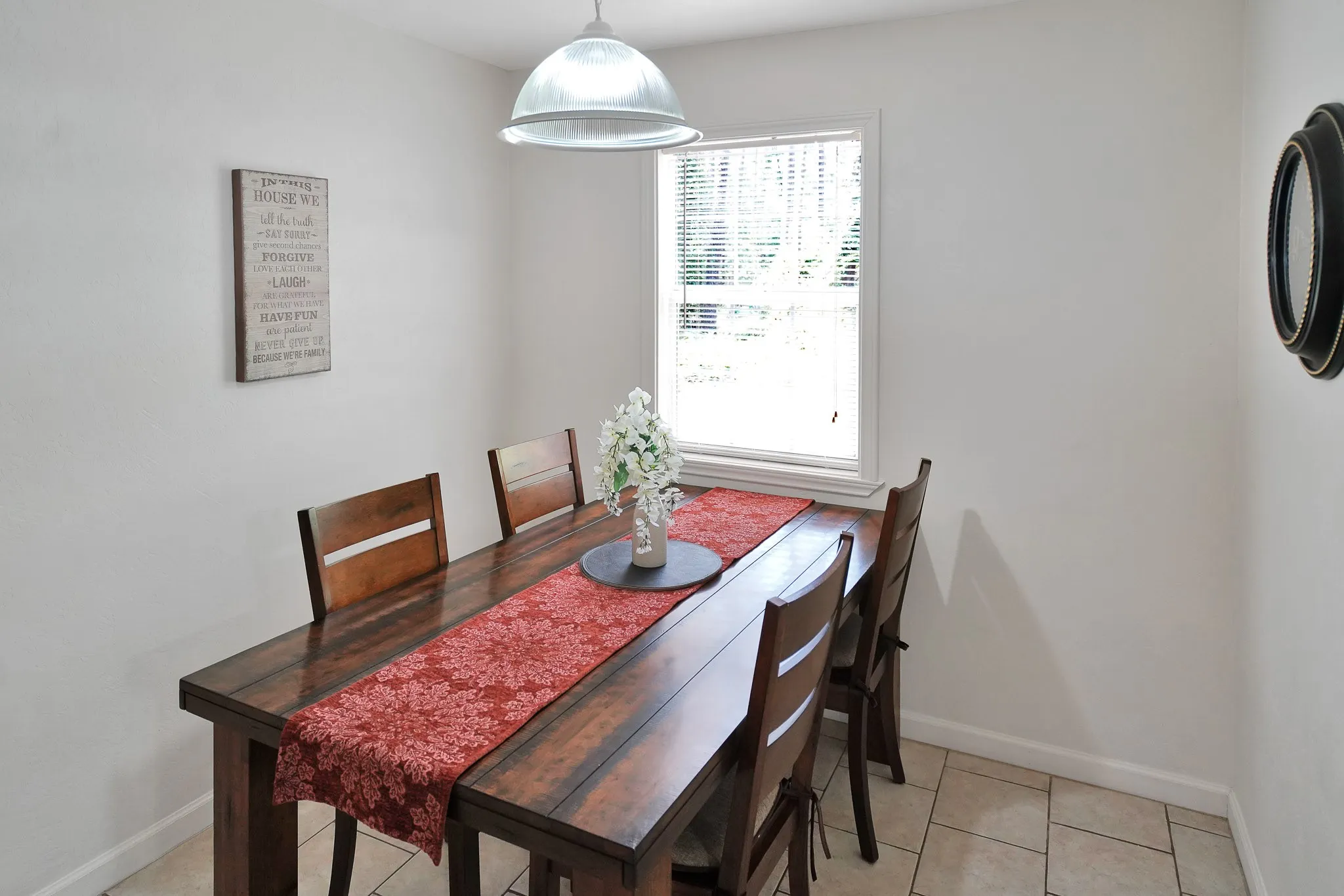 Dining room featuring baseboards and light tile patterned floors