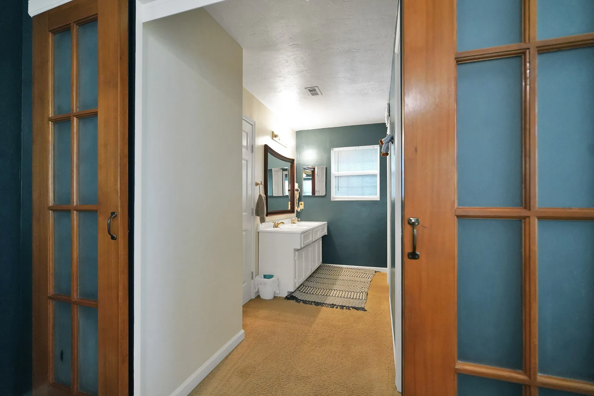 Bathroom with vanity and baseboards