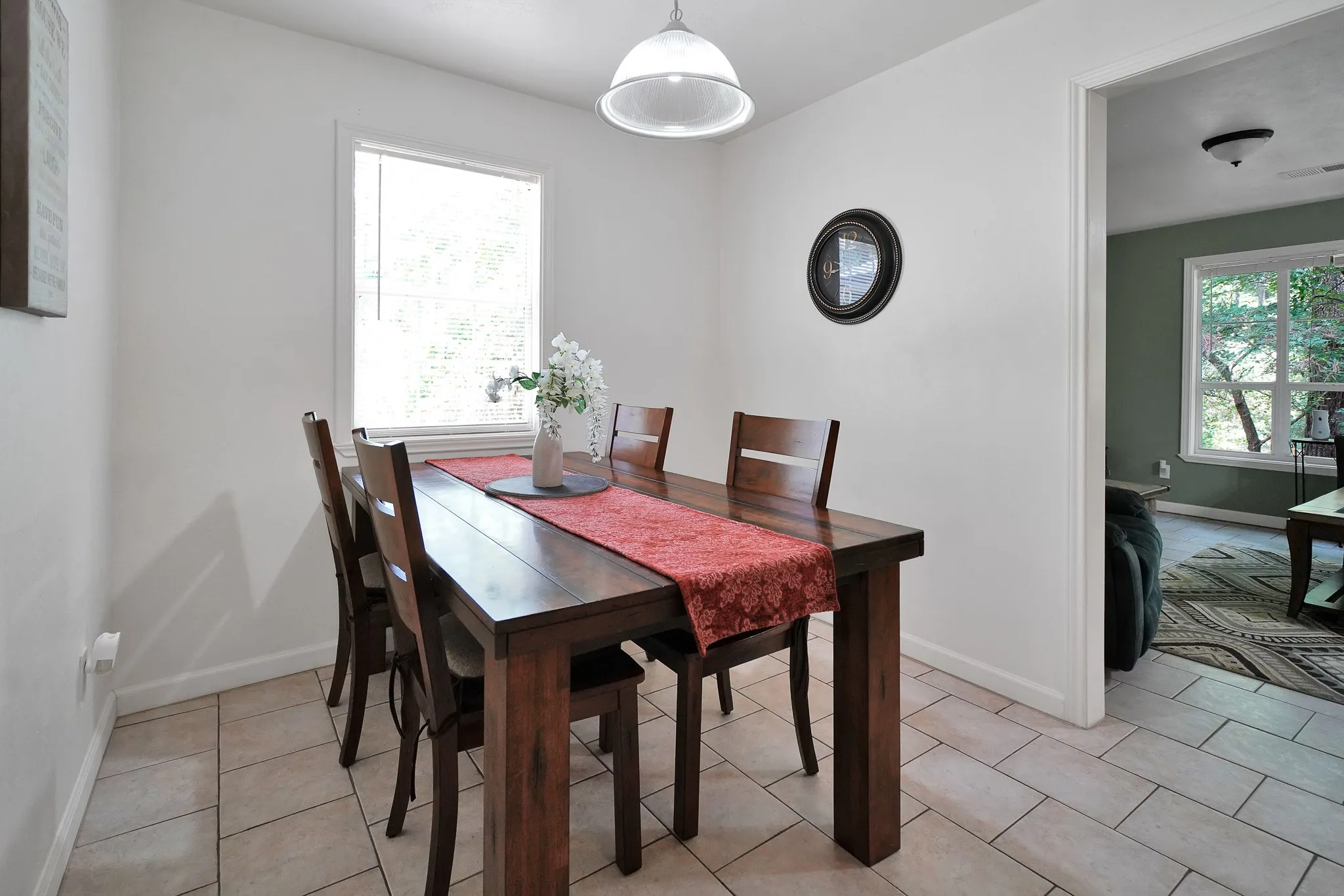 Dining room with baseboards and light tile patterned floors