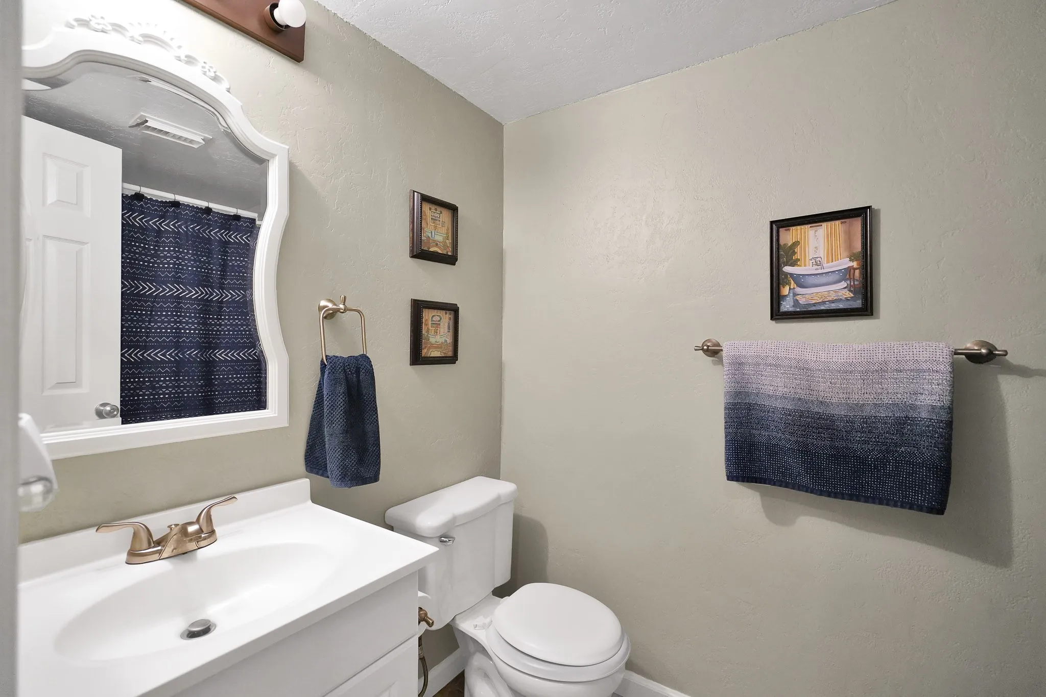 Full bath featuring vanity and toilet