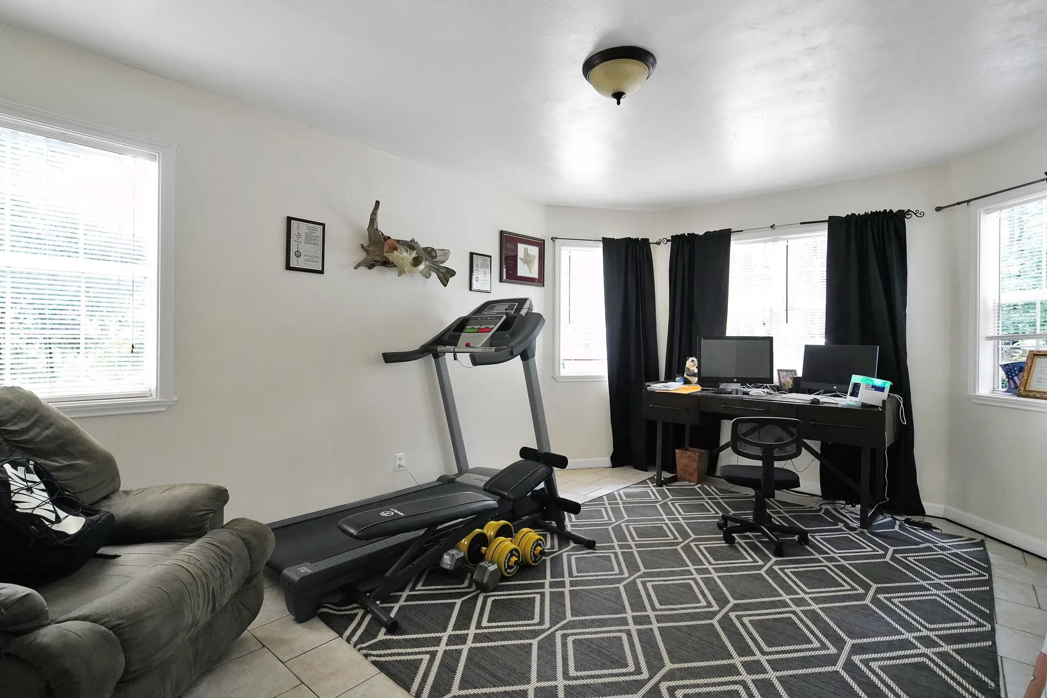 Tiled office space featuring baseboards