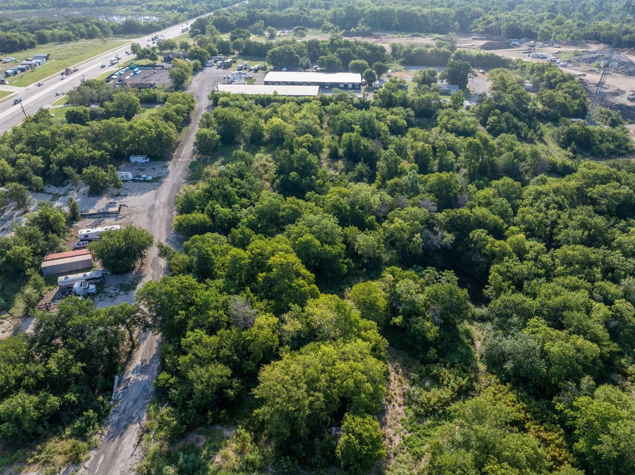 Aerial overview of property's location featuring a major roadway