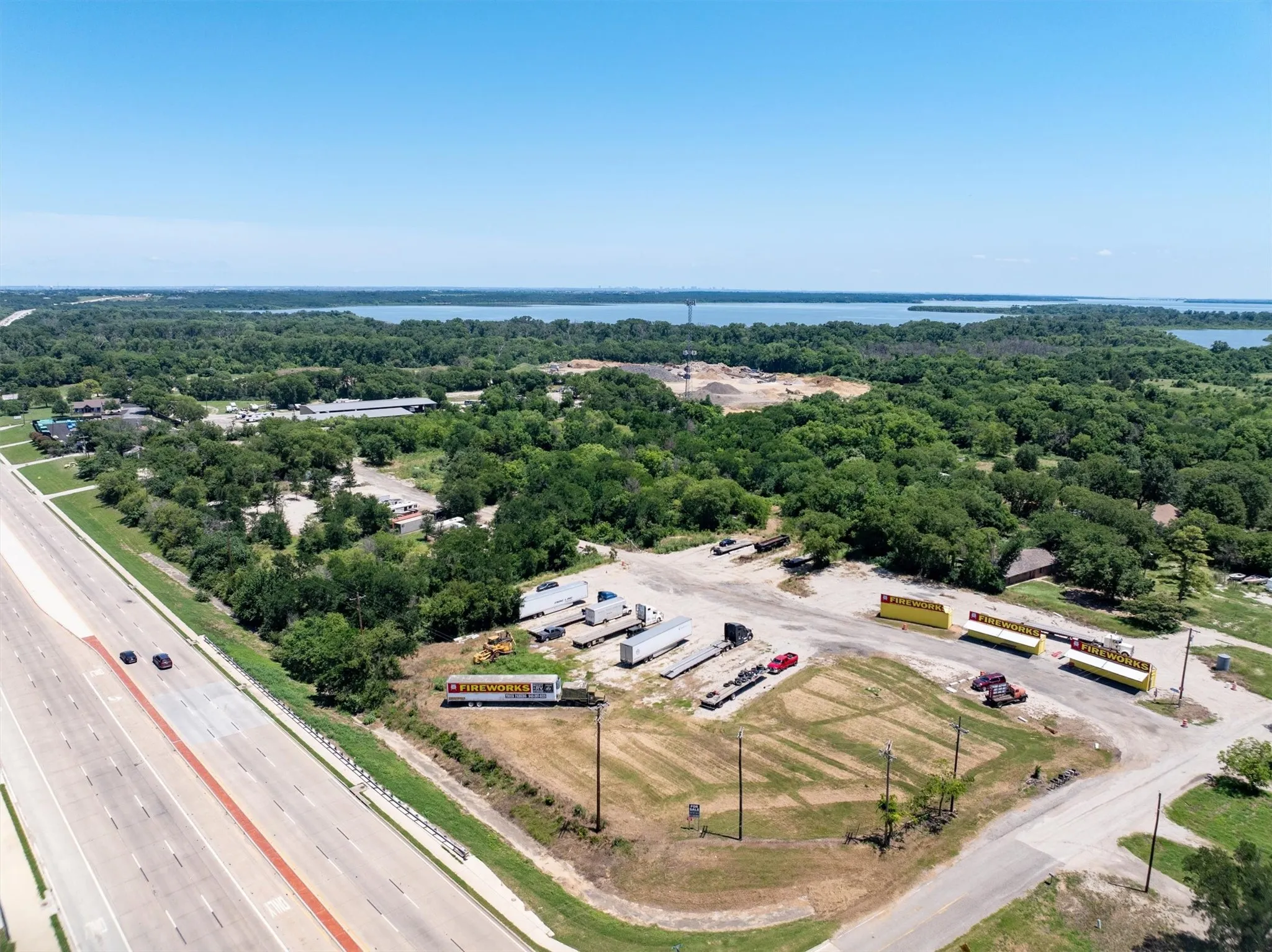 Bird's eye view of a large body of water and a main thoroughfare
