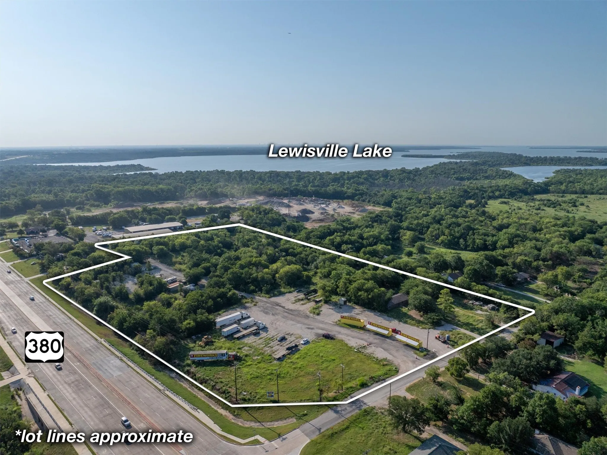 Aerial view of property's location featuring property parcel outlined and a large body of water