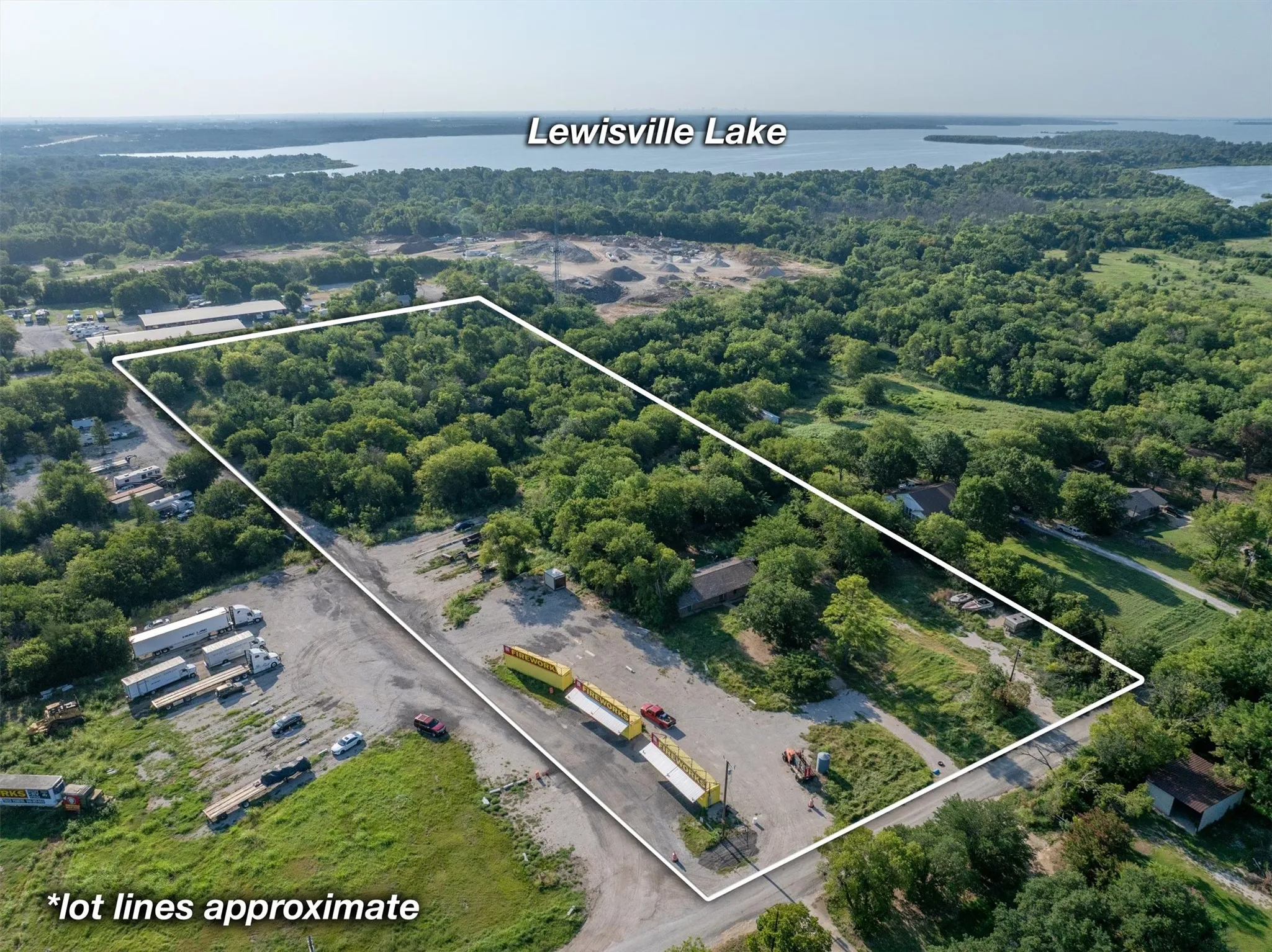 View of property location with property parcel outlined and a nearby body of water