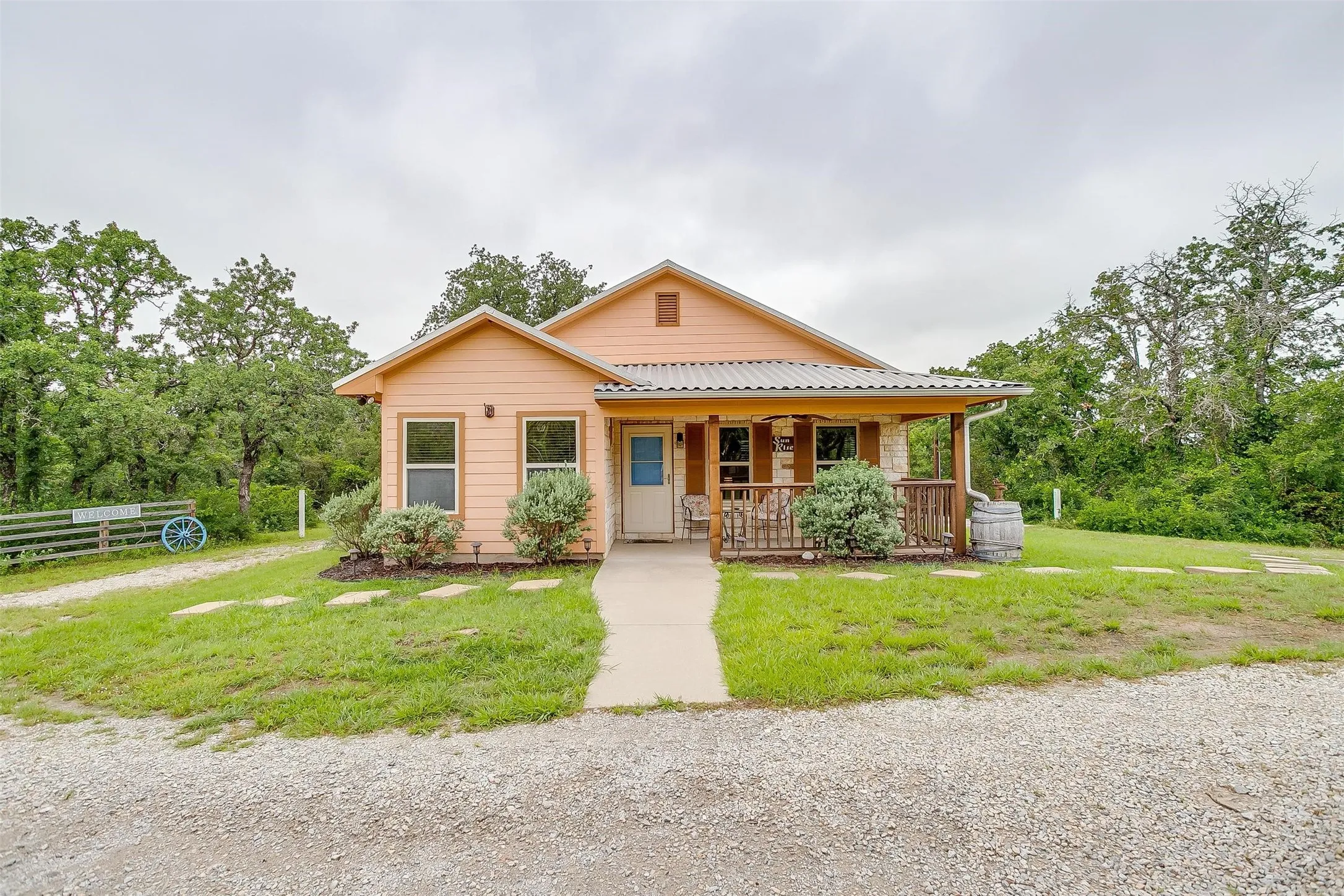 Sun Rise Cabin- Bungalow-style house featuring a porch and a metal roof