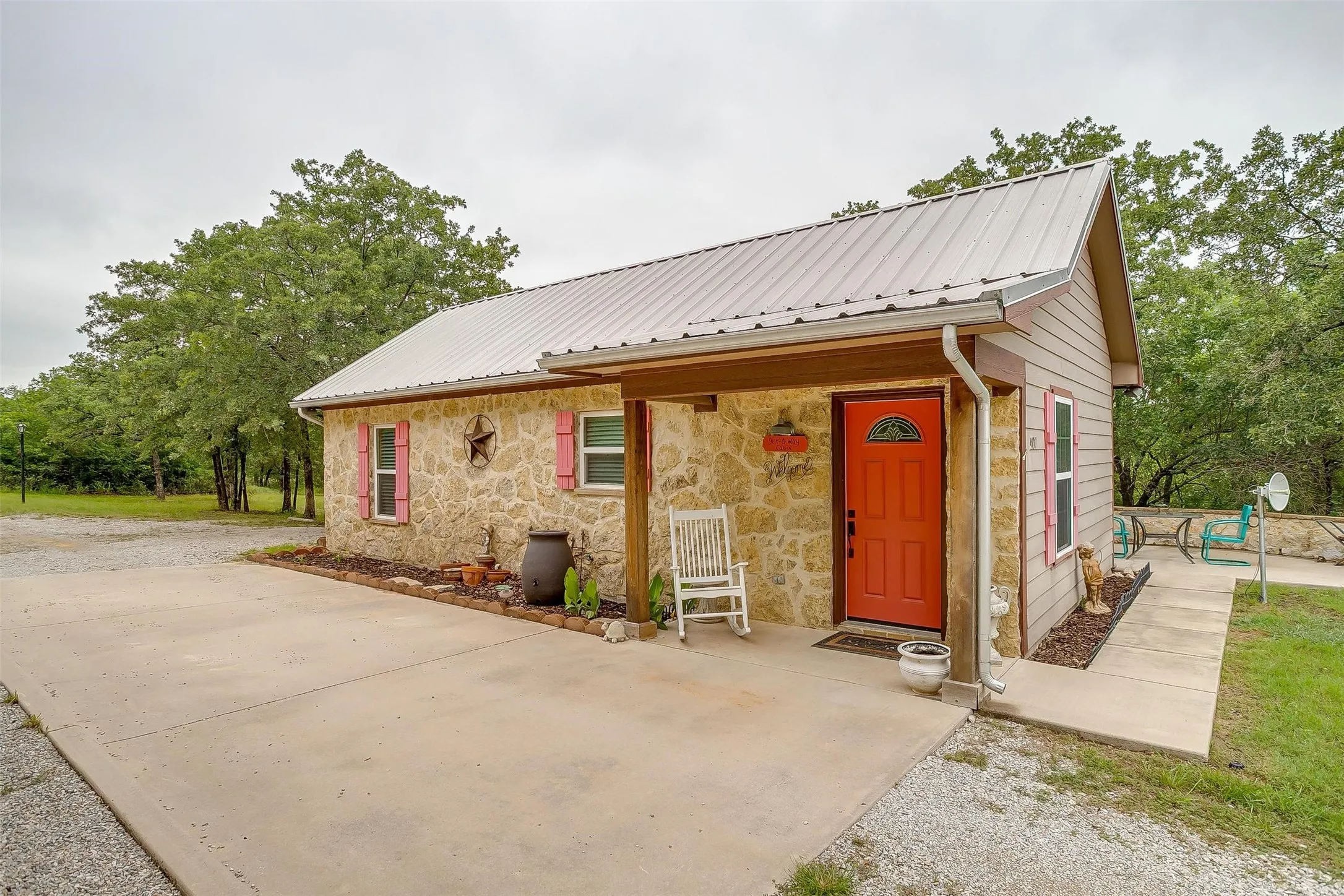 Get-Away Cabin- View of front of property featuring stone siding. Small & cozy 1 bedroom, full kitchen, open concept living room.