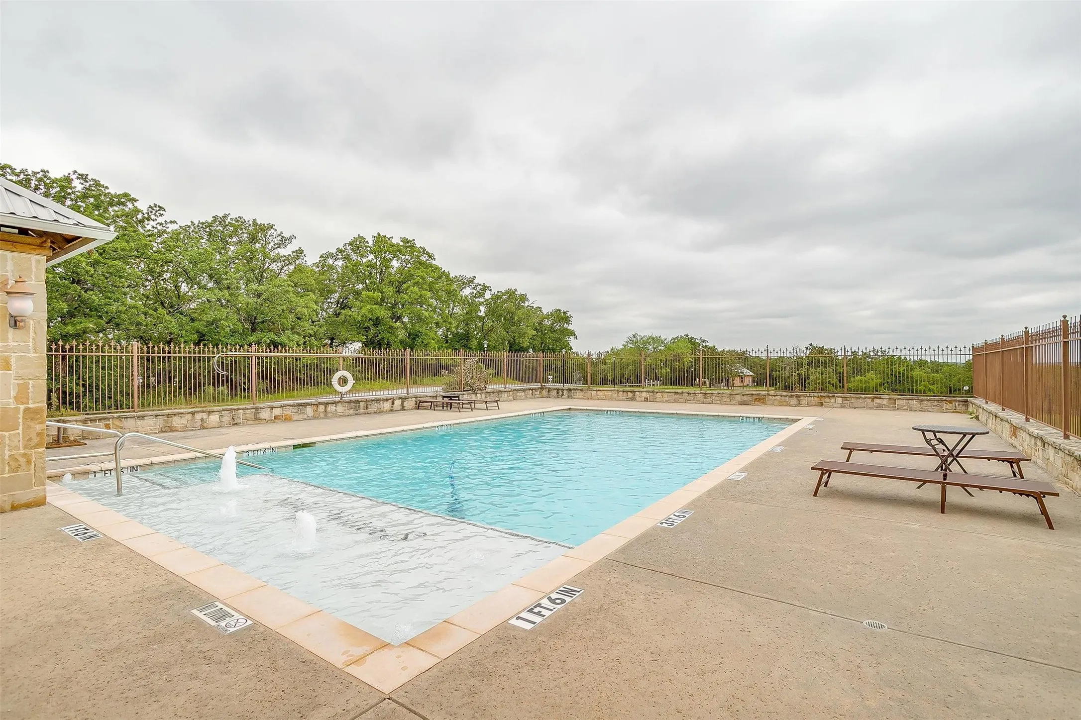 Property Pool that is fully fenced and gated for safety.