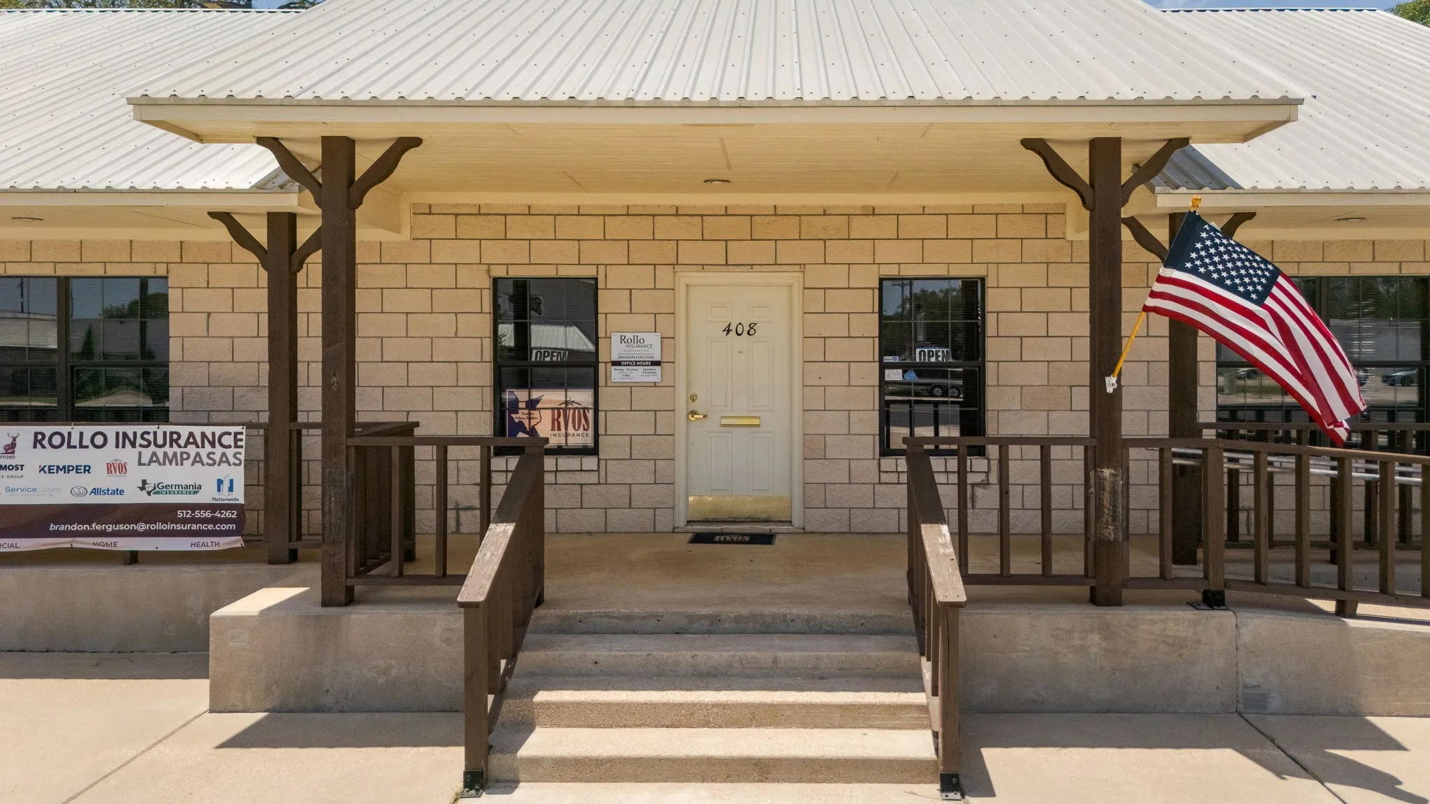 Entrance to property with a metal roof and covered porch