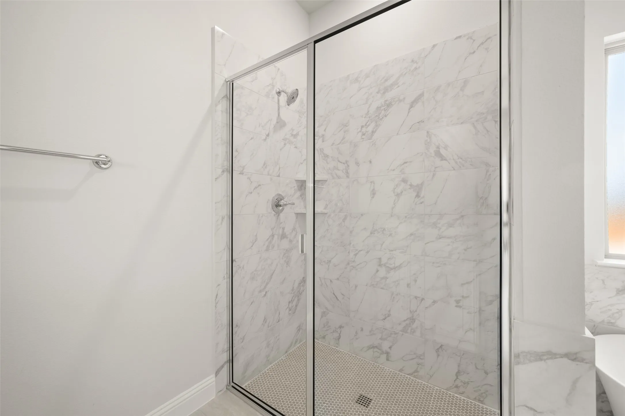 Full bathroom featuring a stall shower and a freestanding tub