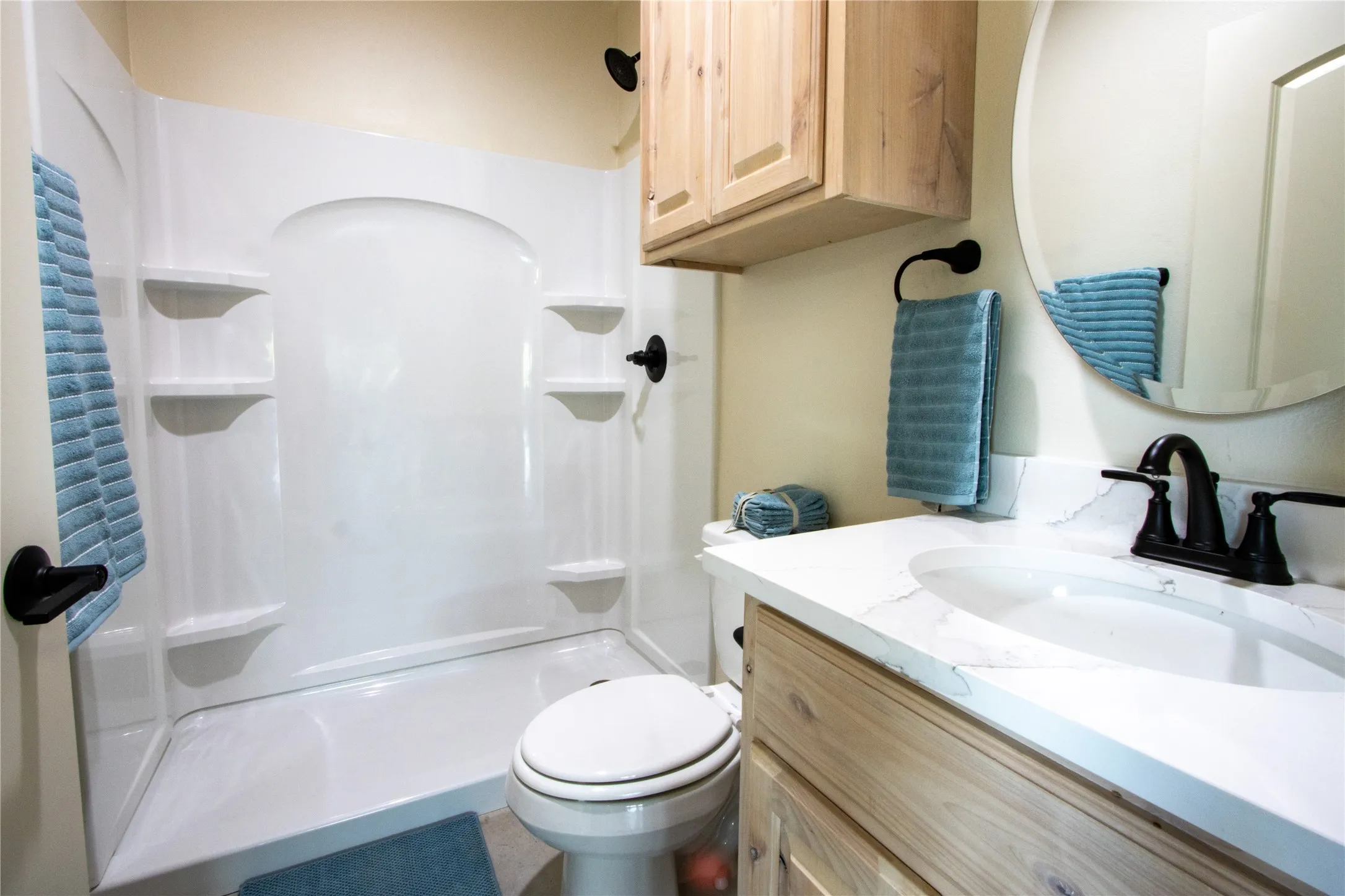 Bathroom with vanity and a shower