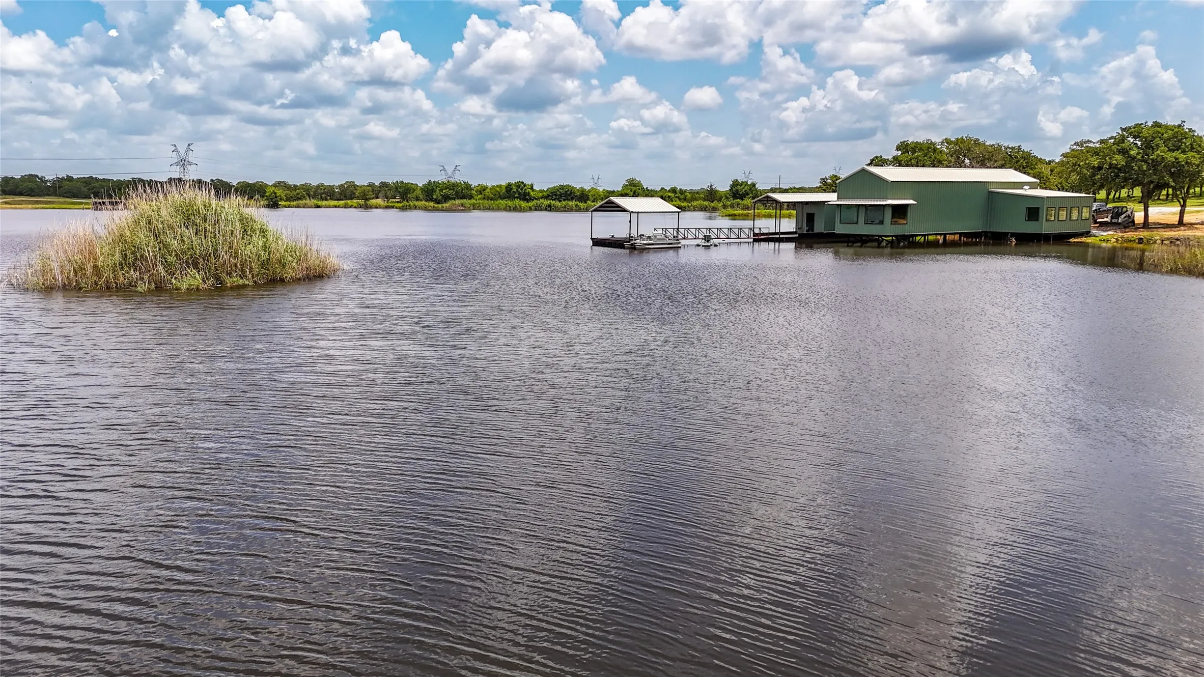 Water view featuring a floating dock