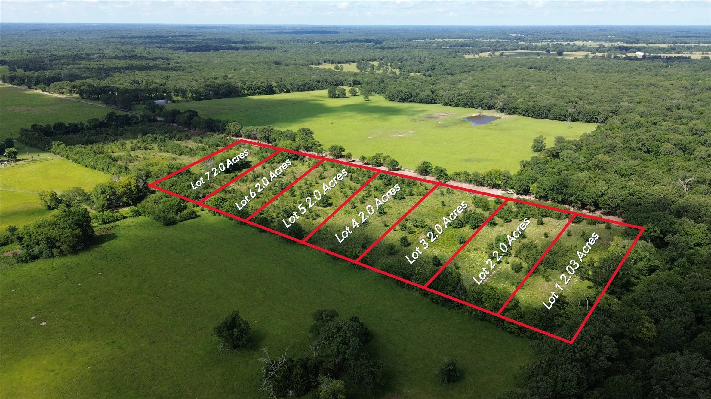 View of property location featuring property parcel outlined and a heavily wooded area