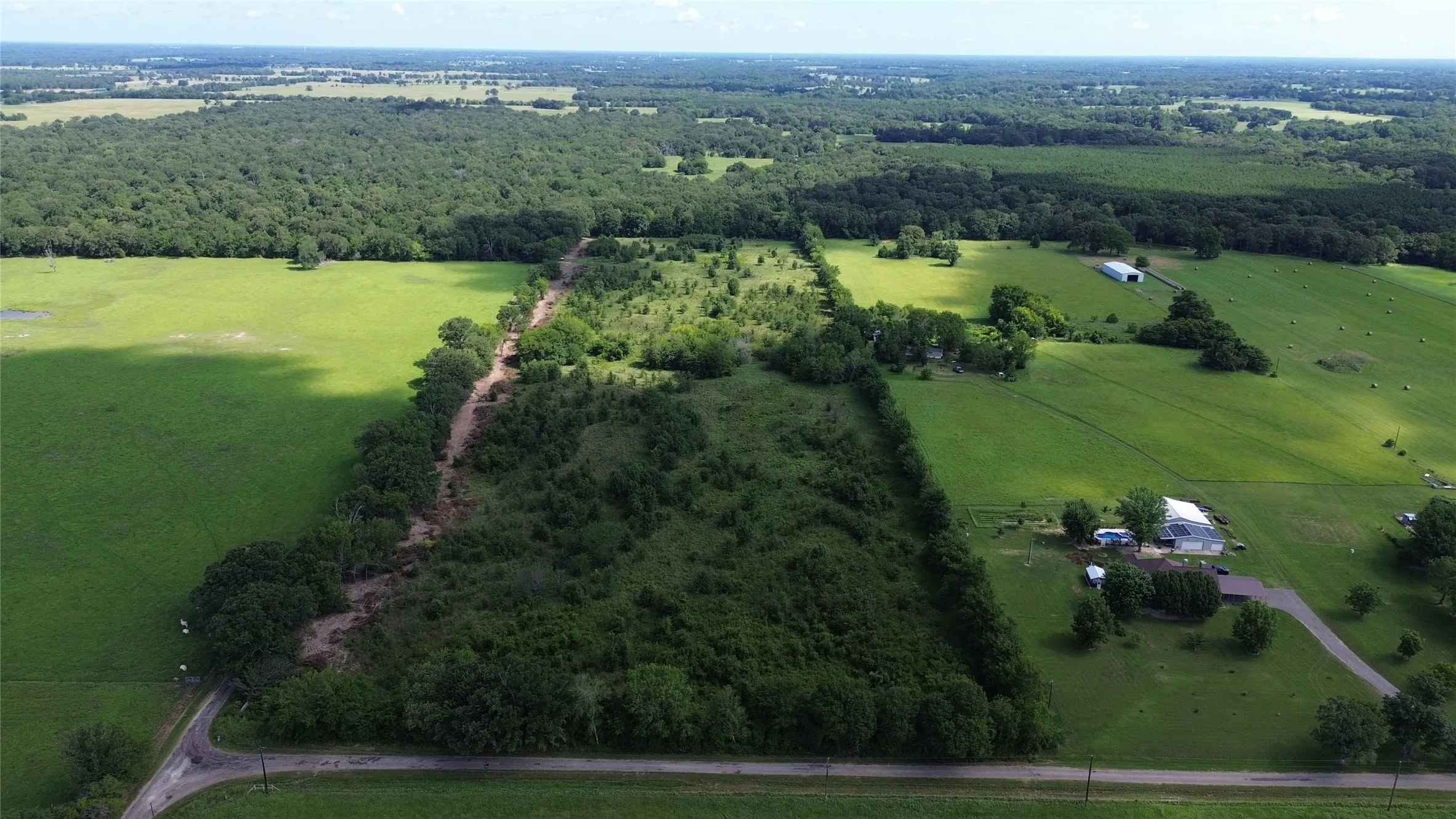 View of rural area with a forest