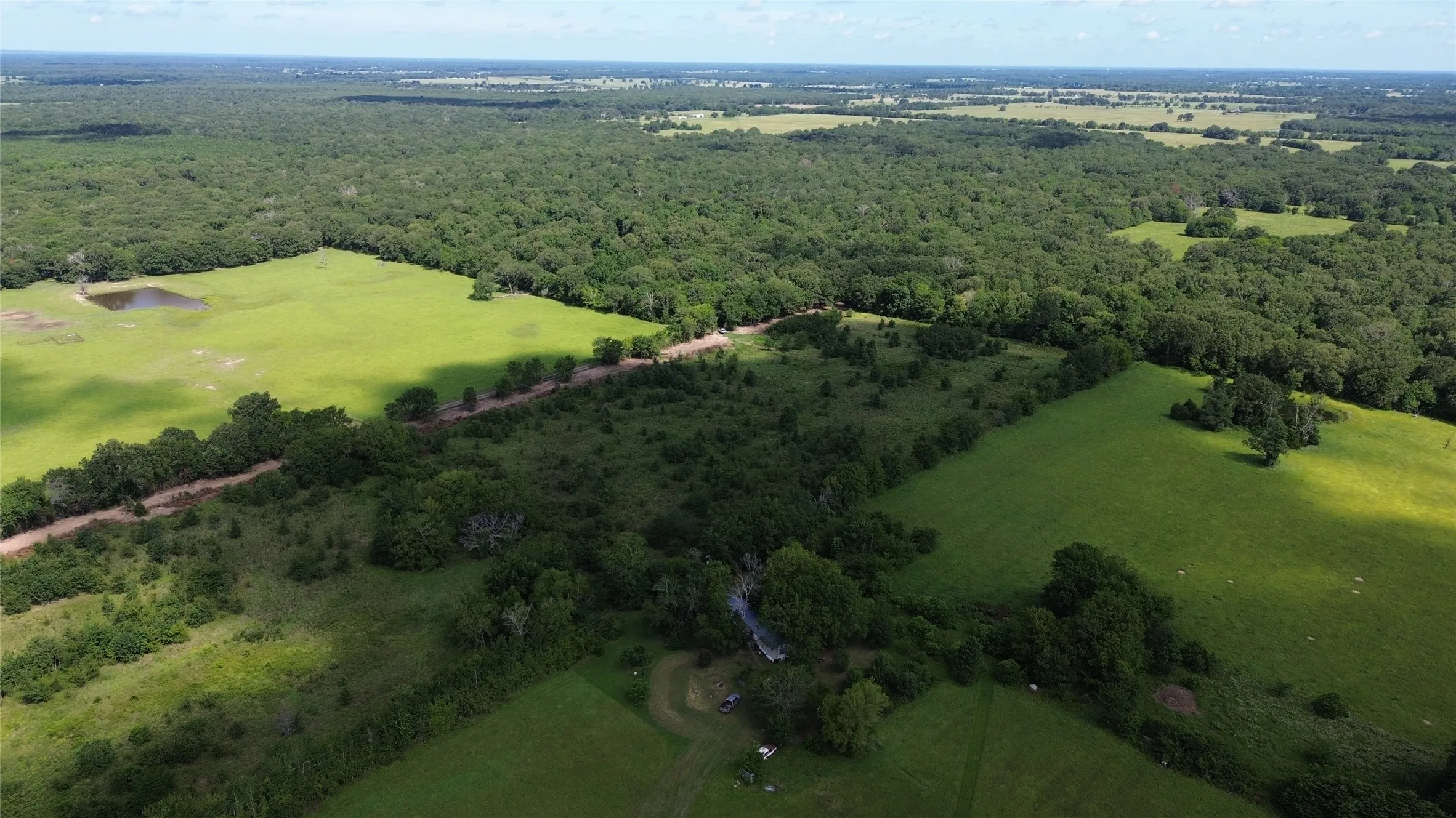 Drone / aerial view of a heavily wooded area