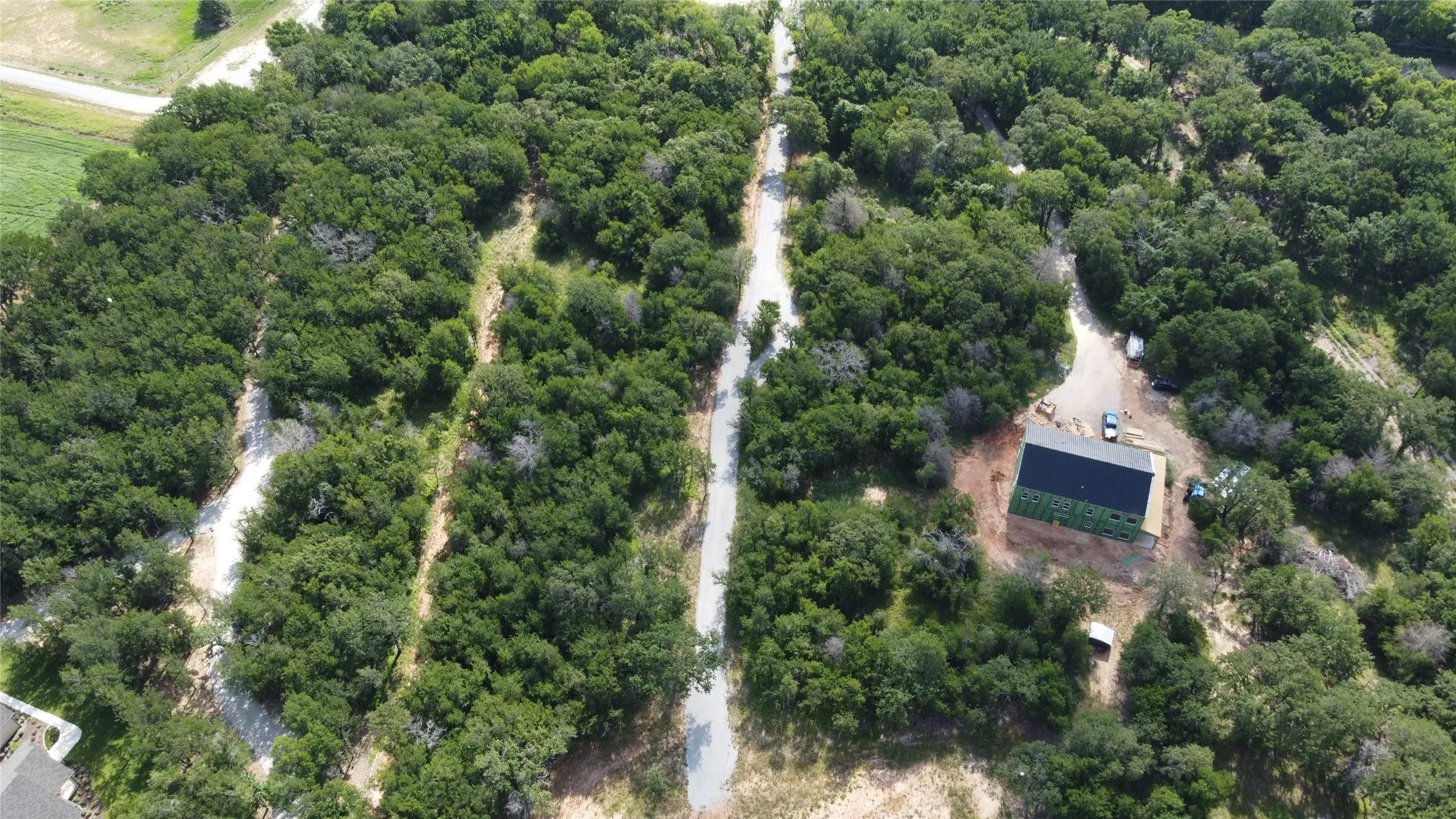 Closer view of the road going front to back to the home site