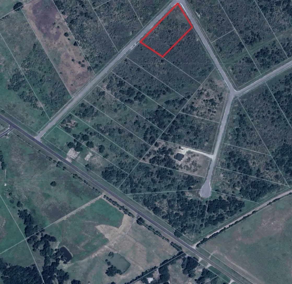 Aerial overview of property's location featuring property parcel outlined