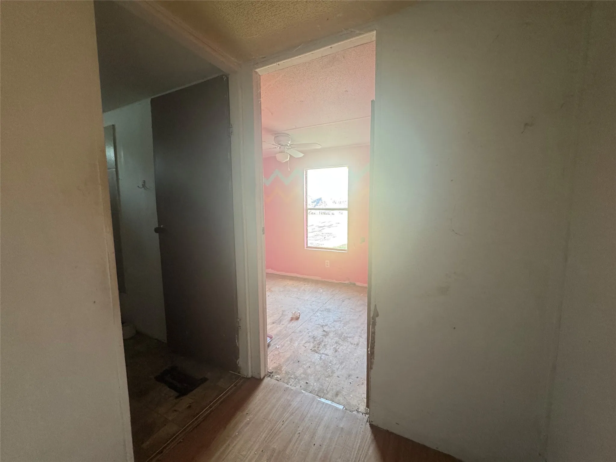 Hall featuring a textured ceiling