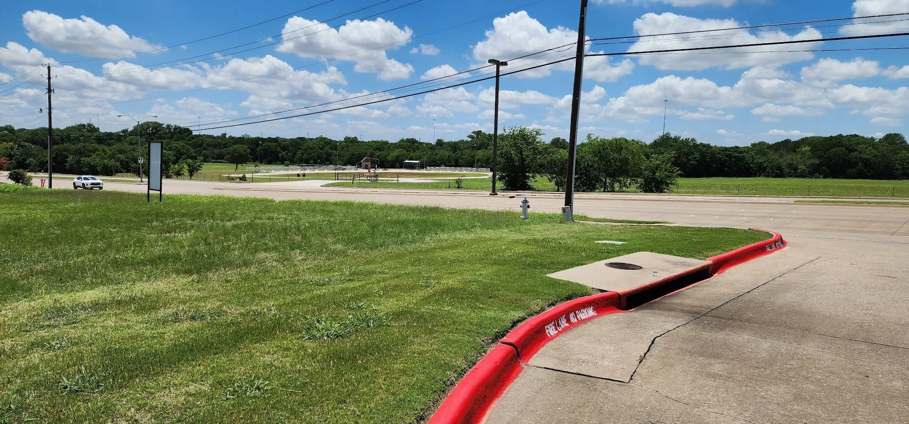 Looking SW across the front part of the property and across Greenville and to the Molsen Farm park development