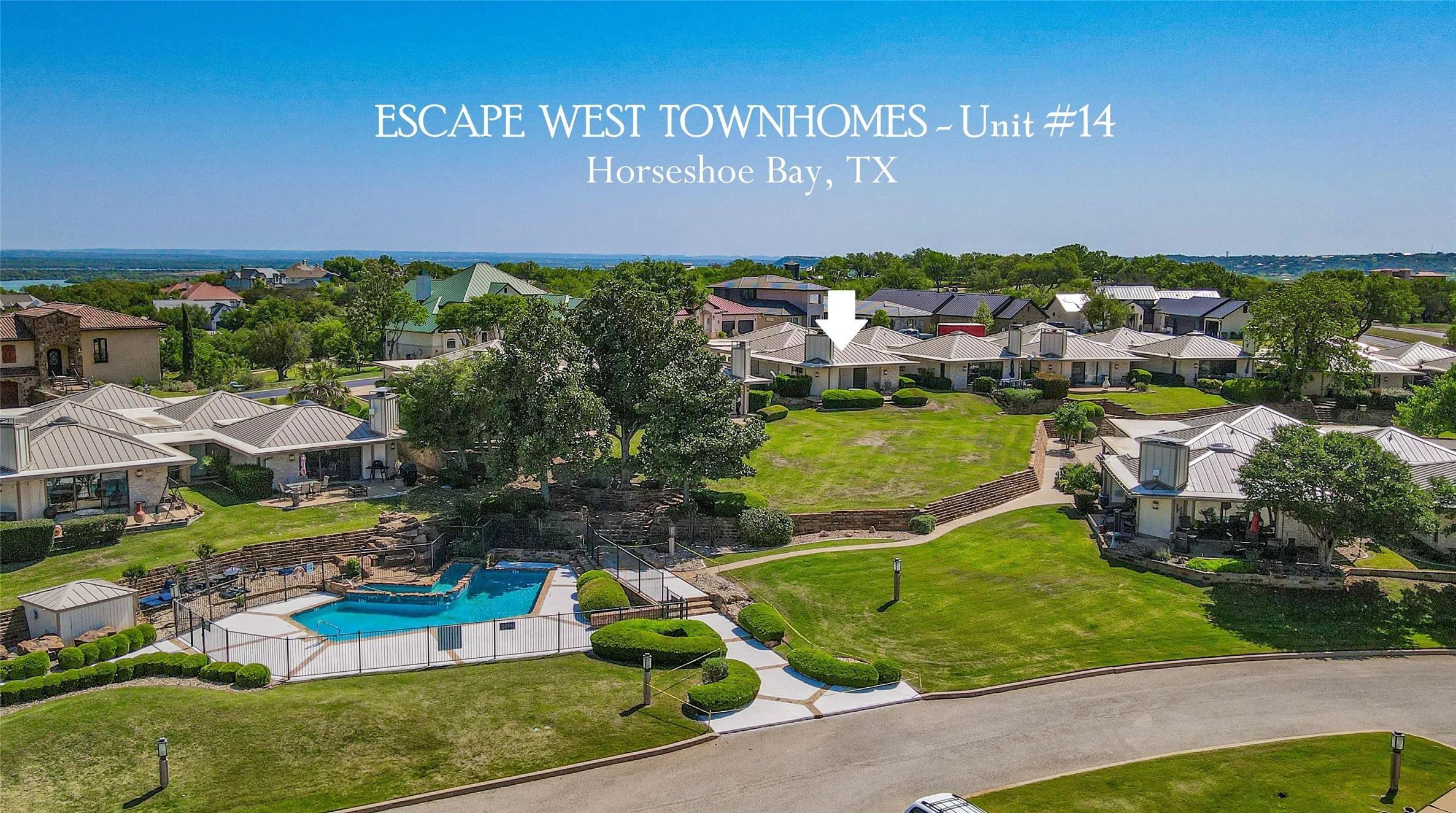 Aerial perspective of suburban area featuring a pool