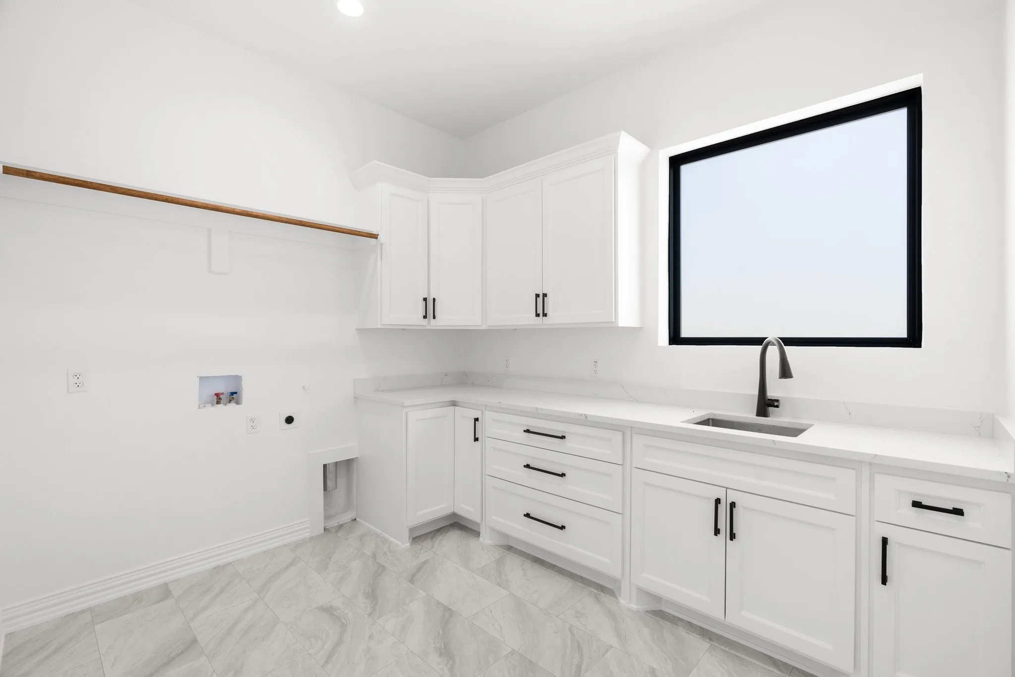 Washroom with hookup for a washing machine, hookup for an electric dryer, cabinet space, and recessed lighting