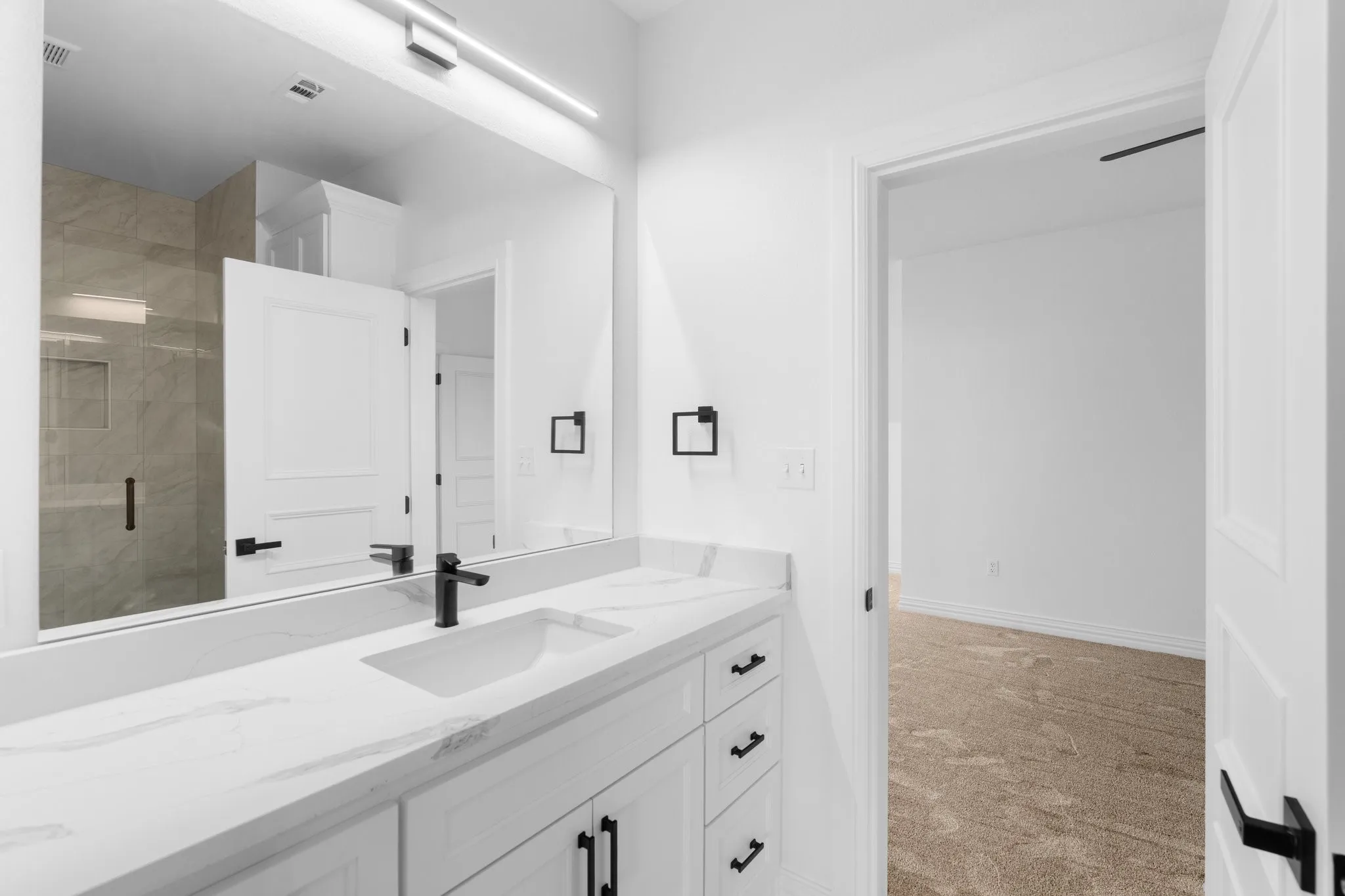 Full bath featuring vanity and a stall shower